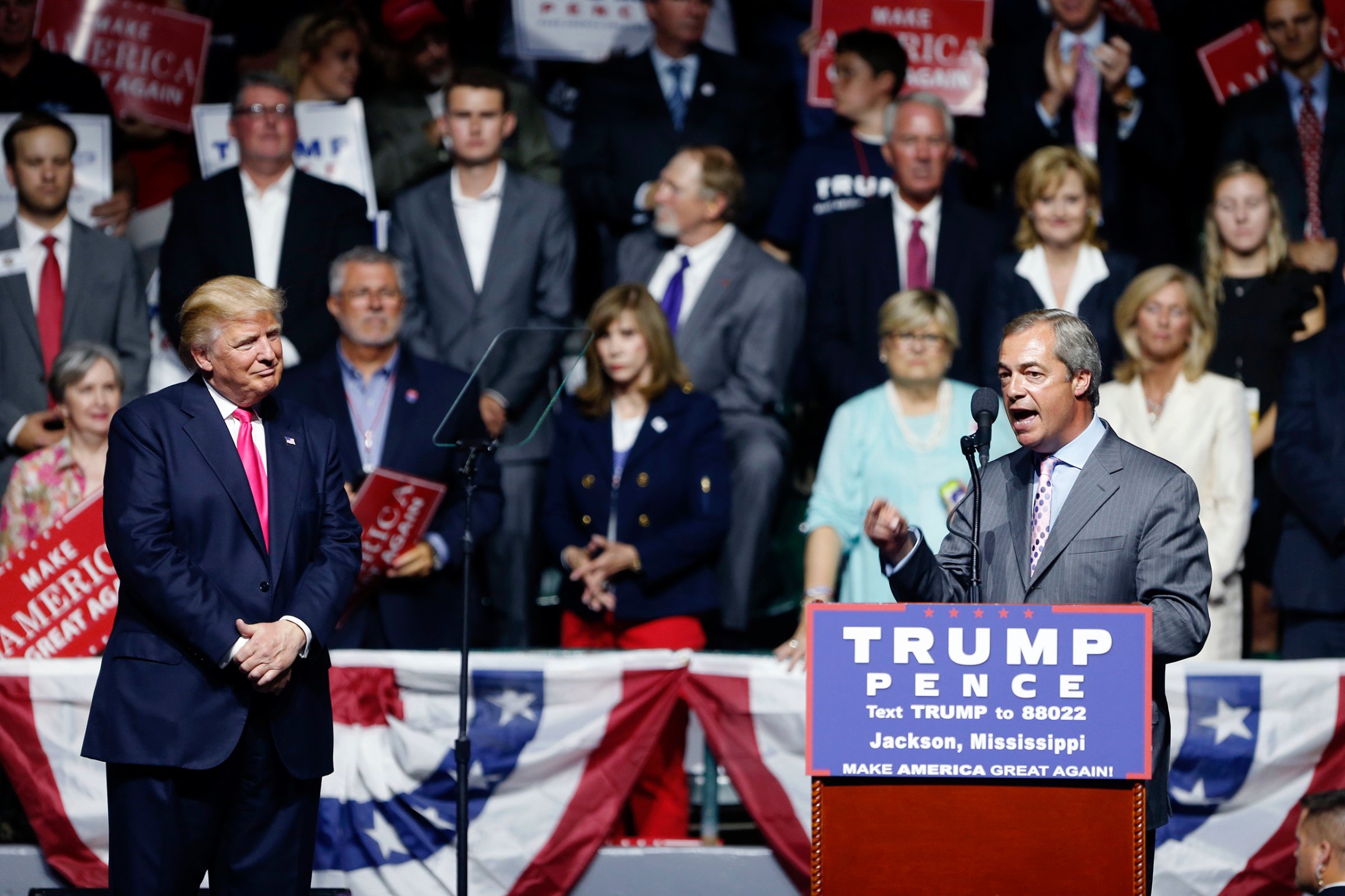 Nigel Farage, ex-leader of the British UKIP party, speaks as Republican presidential candidate Donald Trump listens at Trump's campaign rally in Jackson, Miss., on Aug. 24, 2016.