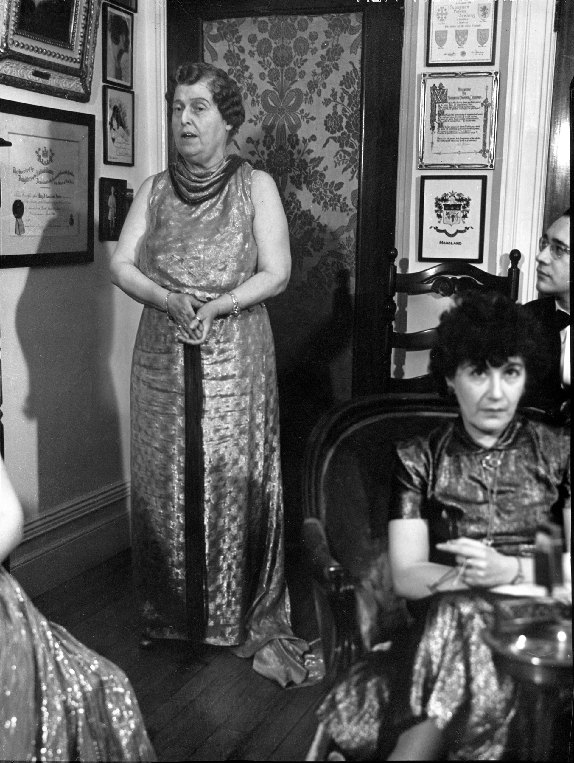 Florence Foster Jenkins (L) entertaining her socialite guests at a formal party in her home in 1937. (Margaret Bourke-White—The LIFE Picture Collection/Getty Images)