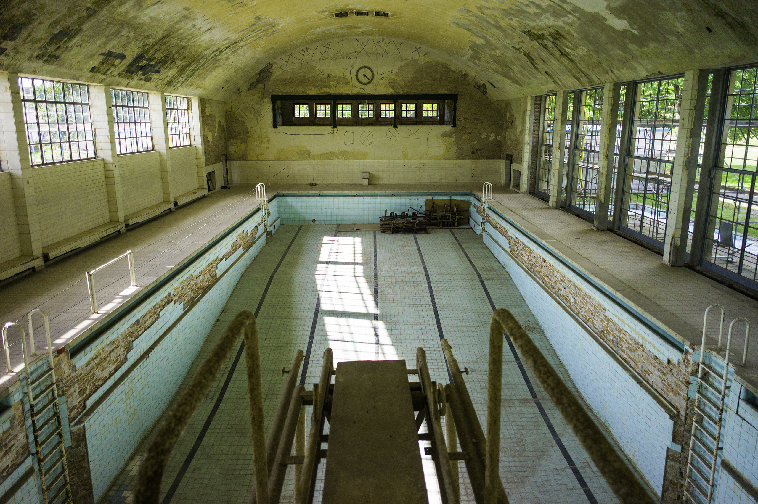 The empty swimming pool at the Olympic Village located west of Berlin, host of the 1936 Olympics, in the town of Elstal. After WWII it was occupied by the Soviet army and used by them until their withdrawal in 1992. The dining hall, the swimming pool, and the gymnasium still stand, along with the ruins of dozens of abandoned housing buildings. After decades of neglect, there is an effort underway to restore the premises as a historic site.