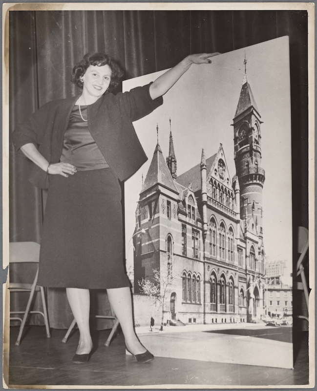 Margot Gayle with an image of the jefferson Market Courthouse (New York Public Library Digital Collections)