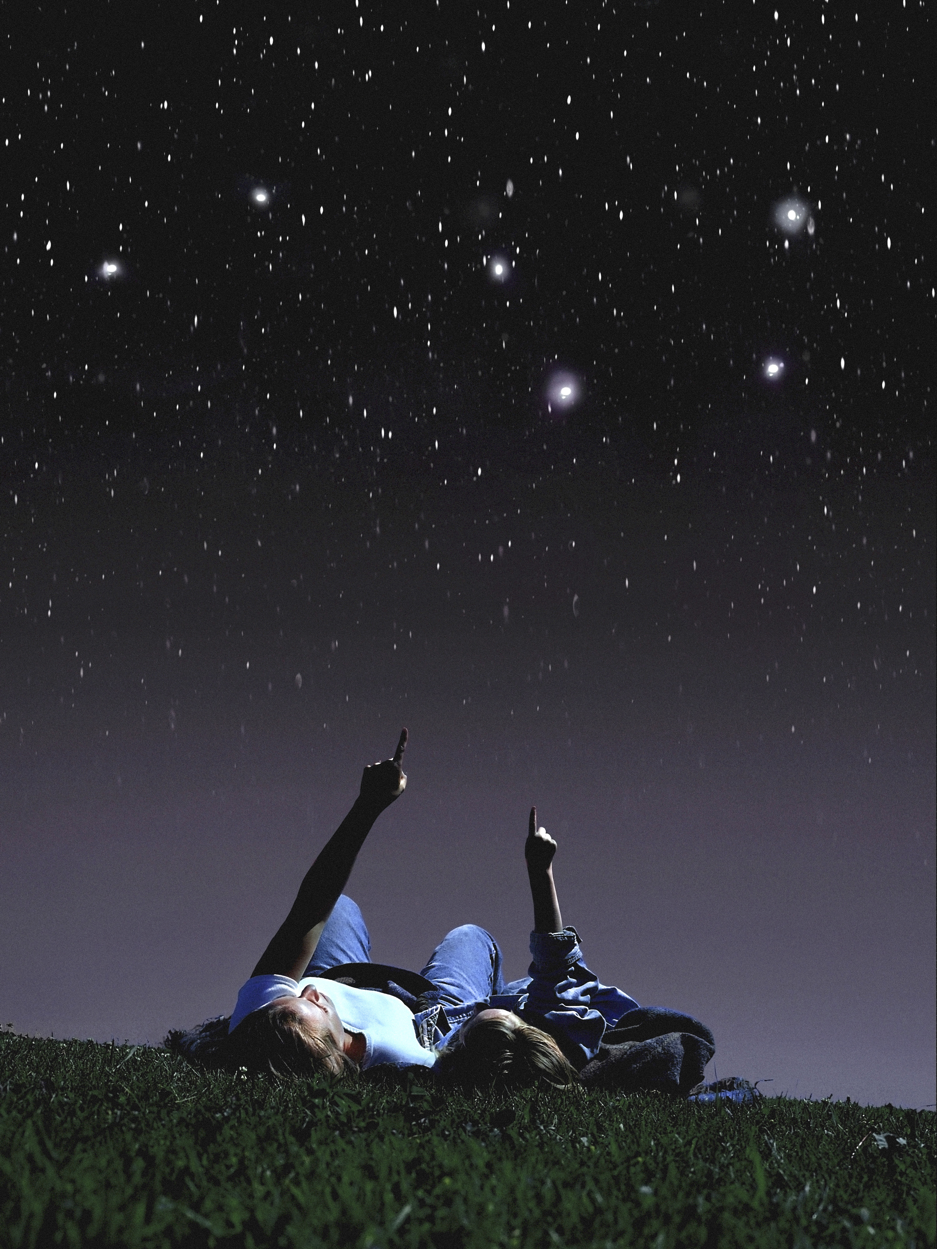 Mother and daughter looking at stars