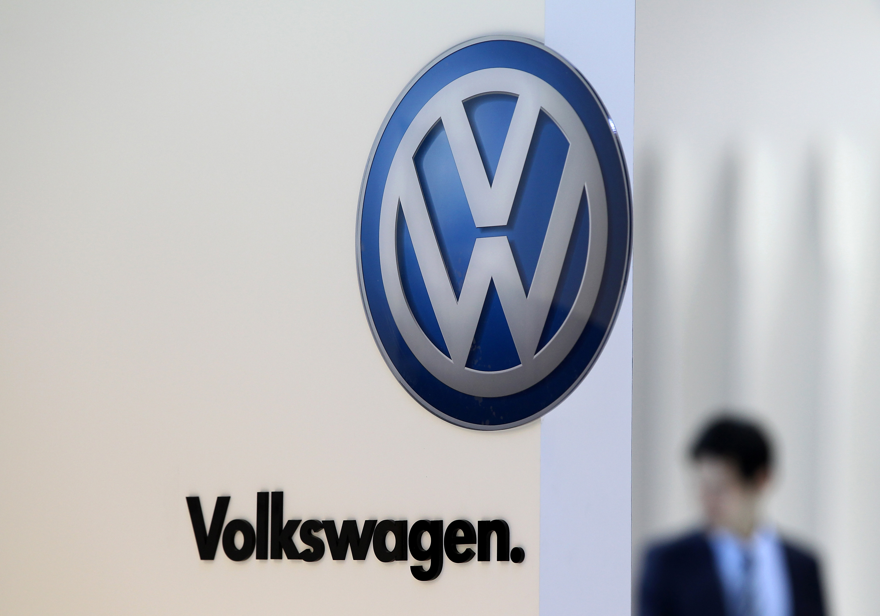 The Volkswagen AG logo is displayed at the company's booth during the media preview of the 2012 Busan International Motor Show in Busan, South Korea, on May 24, 2012. (SeongJoon Cho—Bloomberg/Getty Images)
