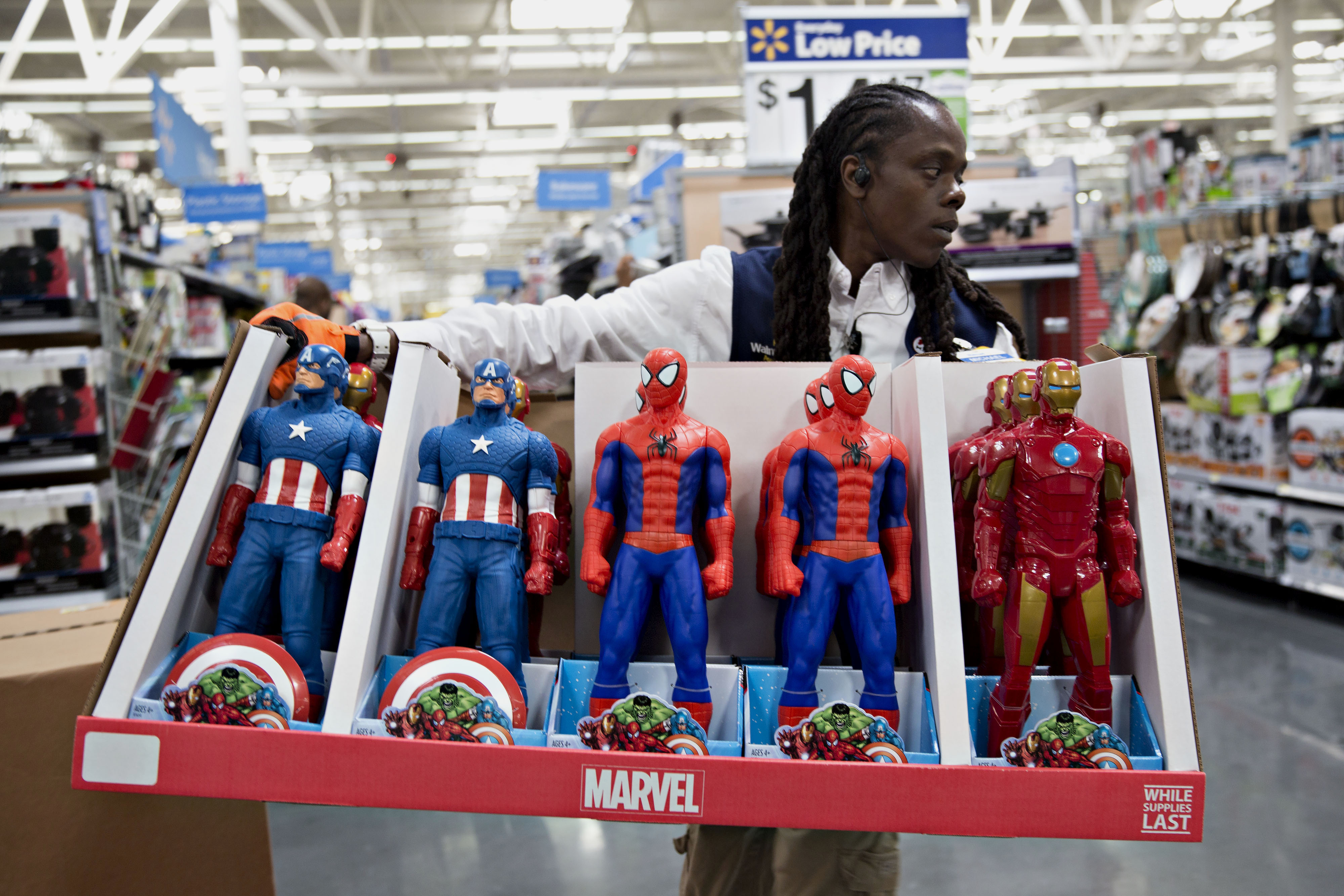 An employee moves Marvel Entertainment LLC action figures in preparation for Black Friday at a Wal-Mart Stores Inc. location in Chicago, Illinois, U.S., on Wednesday, Nov. 25, 2015. (Bloomberg&mdash;Bloomberg via Getty Images)