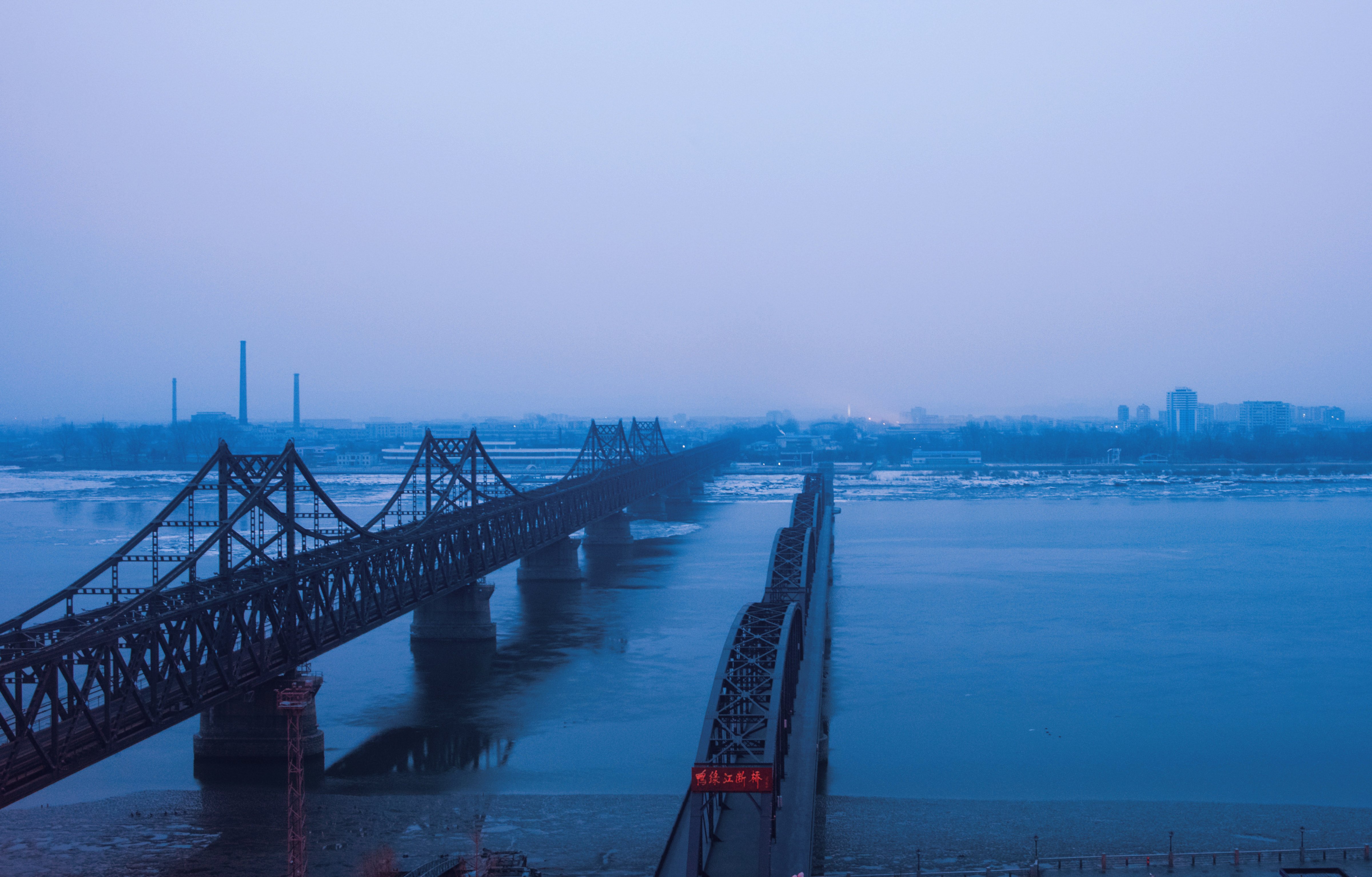 Fog is seen on the banks of the Yalu River in the Chinese border town of Dandong, opposite to the North Korean town of Sinuiju, on February 8, 2016. The UN Security Council strongly condemned North Korea's rocket launch on February 7 and agreed to move quickly to impose new sanctions that will punish Pyongyang for "these dangerous and serious violations." (JOHANNES EISELE—AFP/Getty Images)