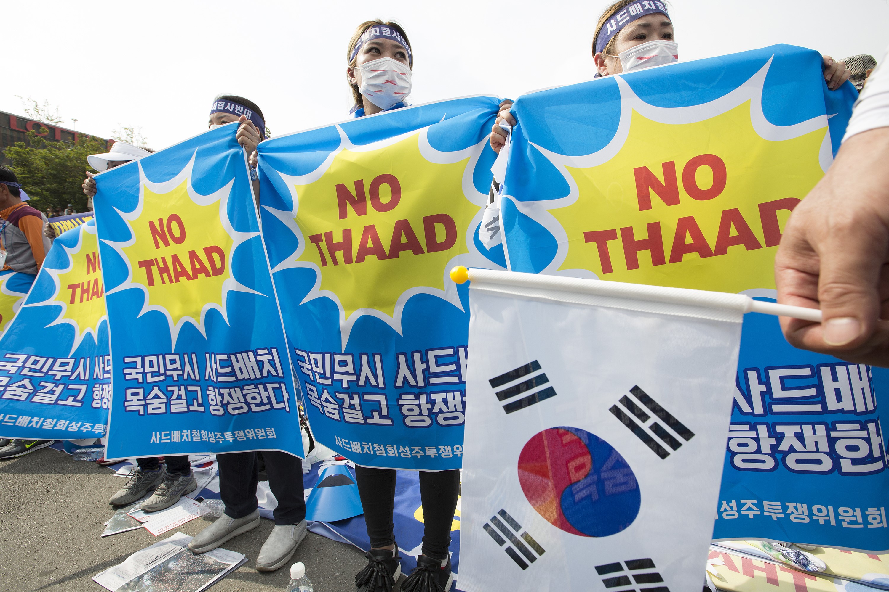 Residents of the Seongju municipality attend a rally in front of Seoul Station in Seoul, South Korea, 21 July 2016, to protest against the deployment of an advanced US missile defense system, known as Terminal High Altitude Area Defense (THAAD), in the town of Seongju, a county some 300 kilometers southeast of Seoul. (Anadolu Agency—Getty Images)