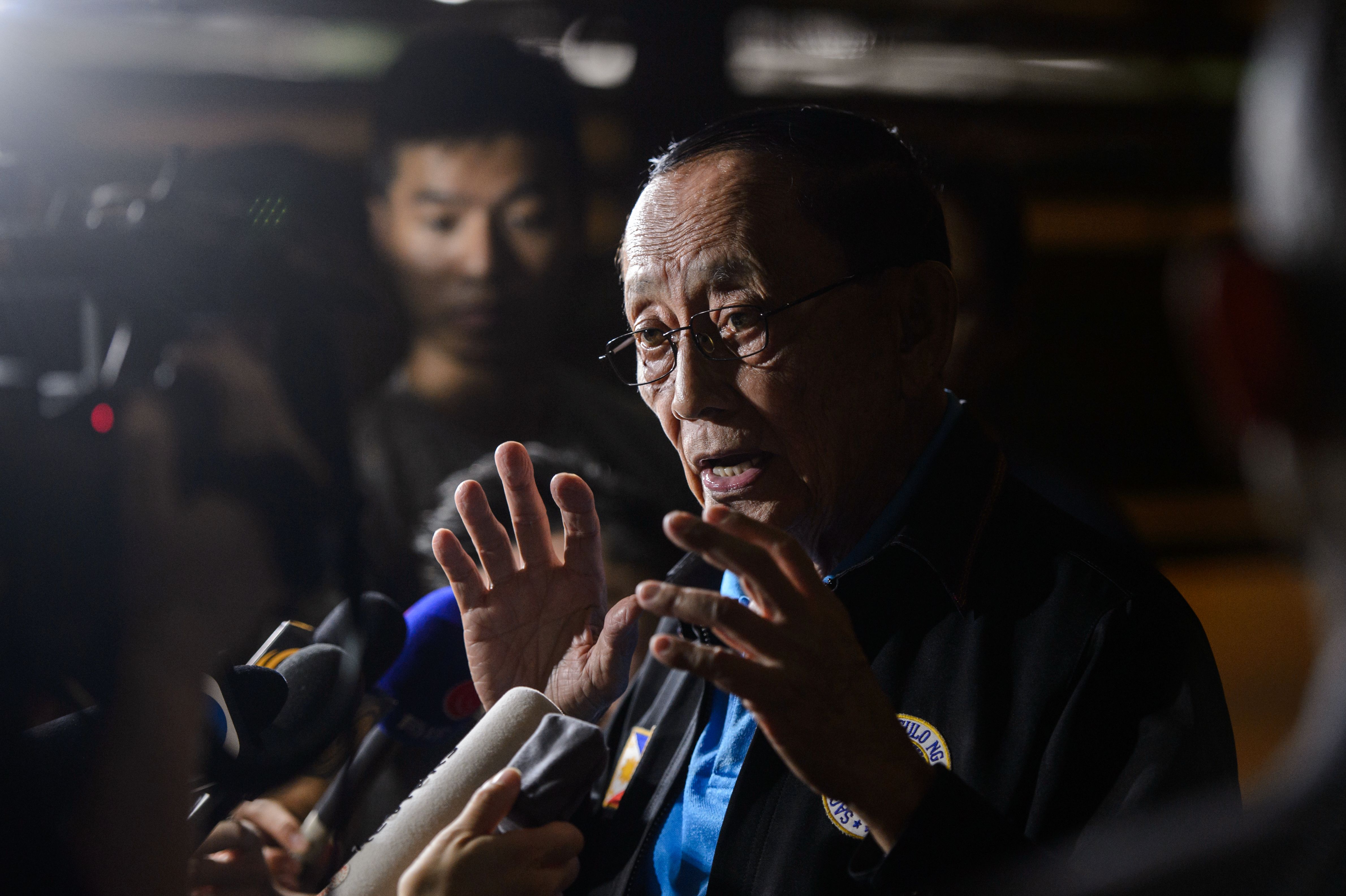 Ex-Philippine President Fidel Ramos, center, whom President Rodrigo Duterte named as his envoy for talks with Beijing, speaks to the press shortly after his arrival at Hong Kong International Airport in Hong Kong on Aug. 8, 2016 (Anthony Wallace—AFP/Getty Images)