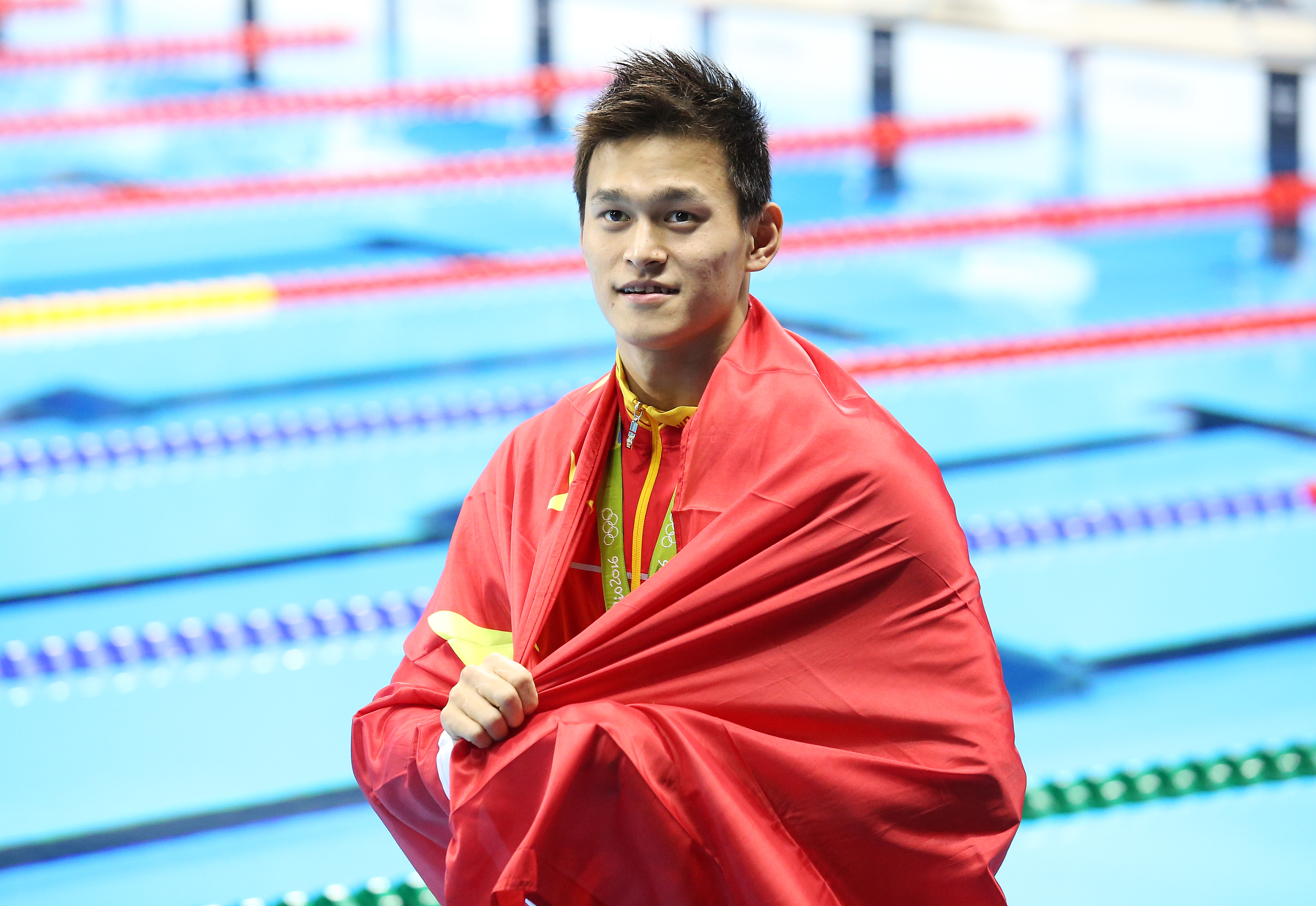 Sun Yang of China celebrates winning the gold medal in the men's 200-m freestyle on day 3 of the Olympic Games on Aug. 8, 2016, in Rio de Janeiro (Jean Catuffe—Getty Images)