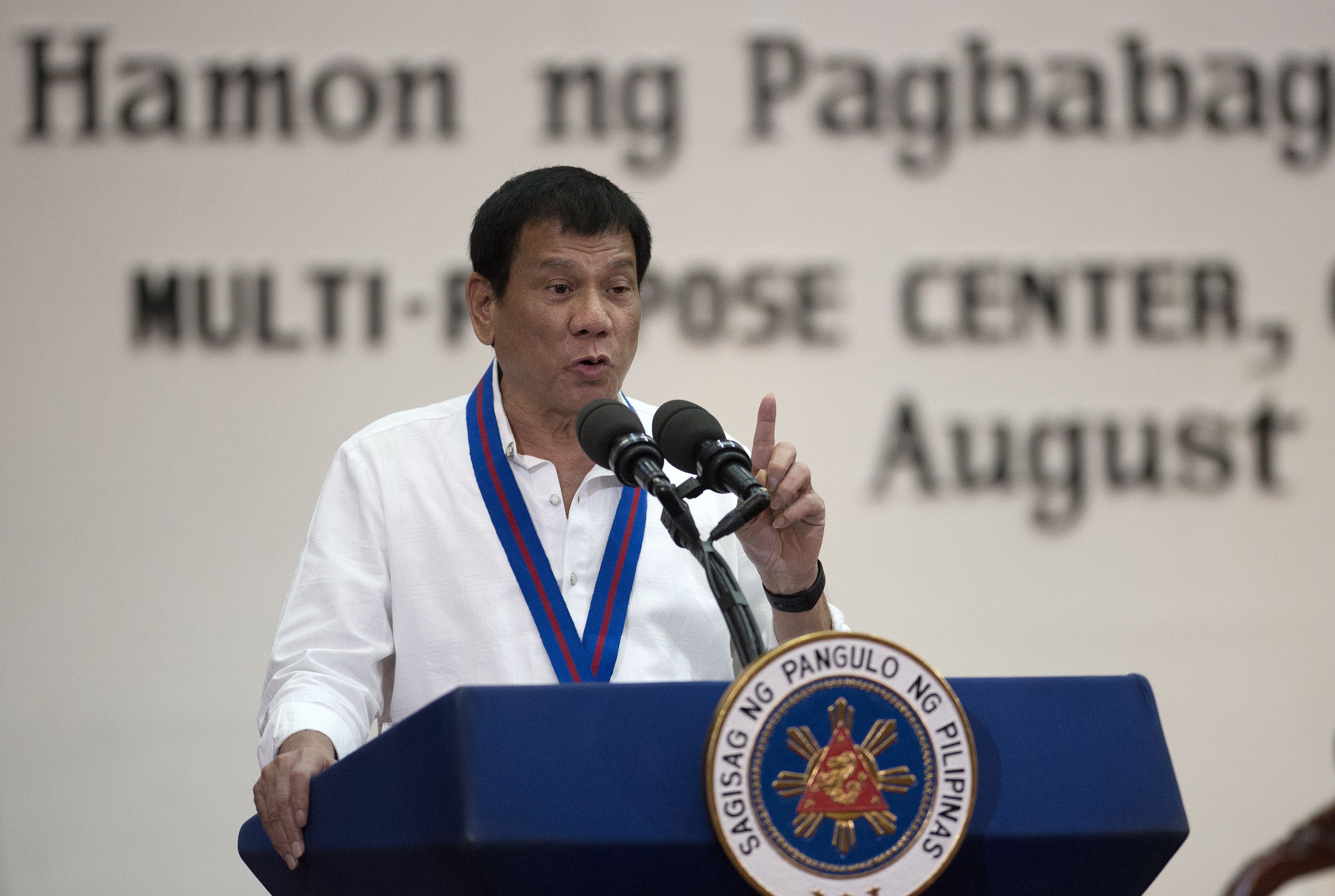 Philippine President Rodrigo Duterte gestures as he talks during the 115th police-service anniversary at the Philippine National Police headquarters in Manila on Aug. 17, 2016 (Noel Celis—AFP/Getty Images)