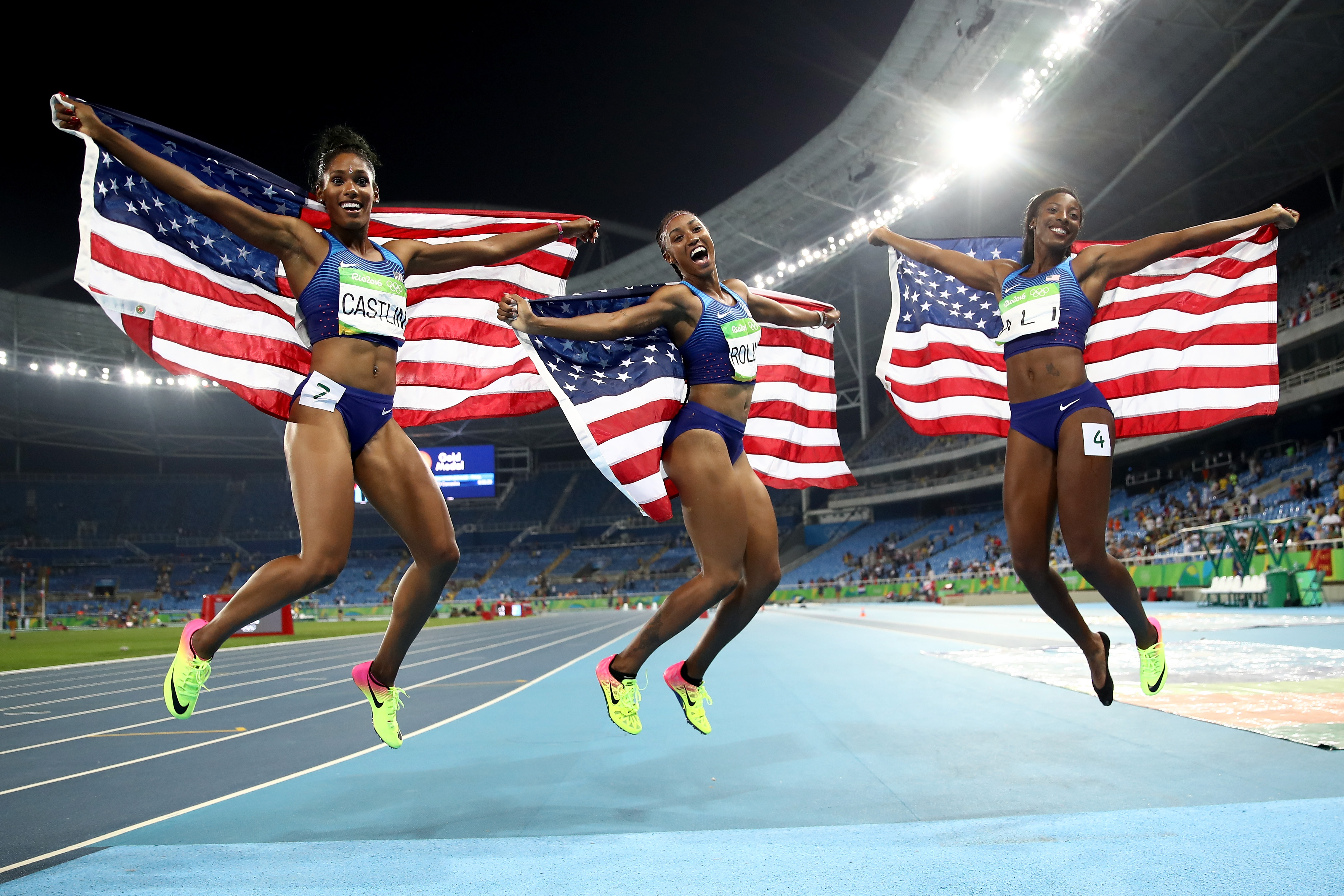 Bronze medalist Kristi Castlin, gold medalist Brianna Rollins and silver medalist Nia Ali of the United States after the Women's 100m Hurdles Final on Aug. 17, 2016 in Rio de Janeiro, Brazil. (Cameron Spencer—Getty Images)