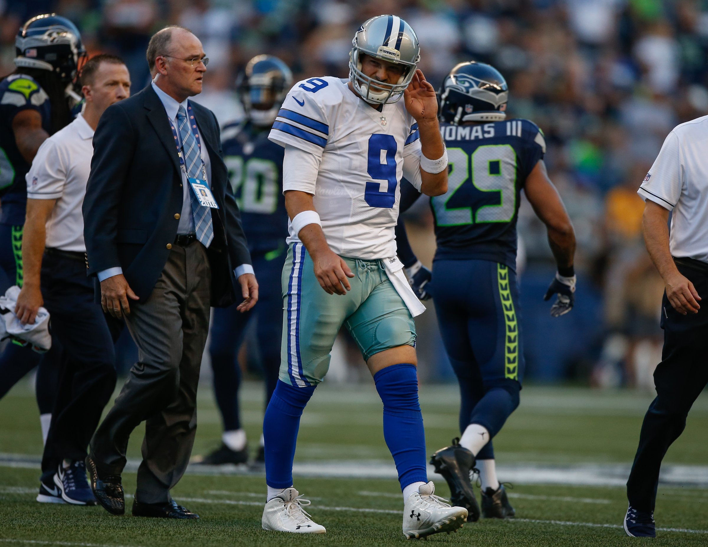 Quarterback Tony Romo of the Dallas Cowboys leaves the field after being injured during a preseason game against the Seattle Seahawks in Seattle, Washington, on Aug. 25, 2016.