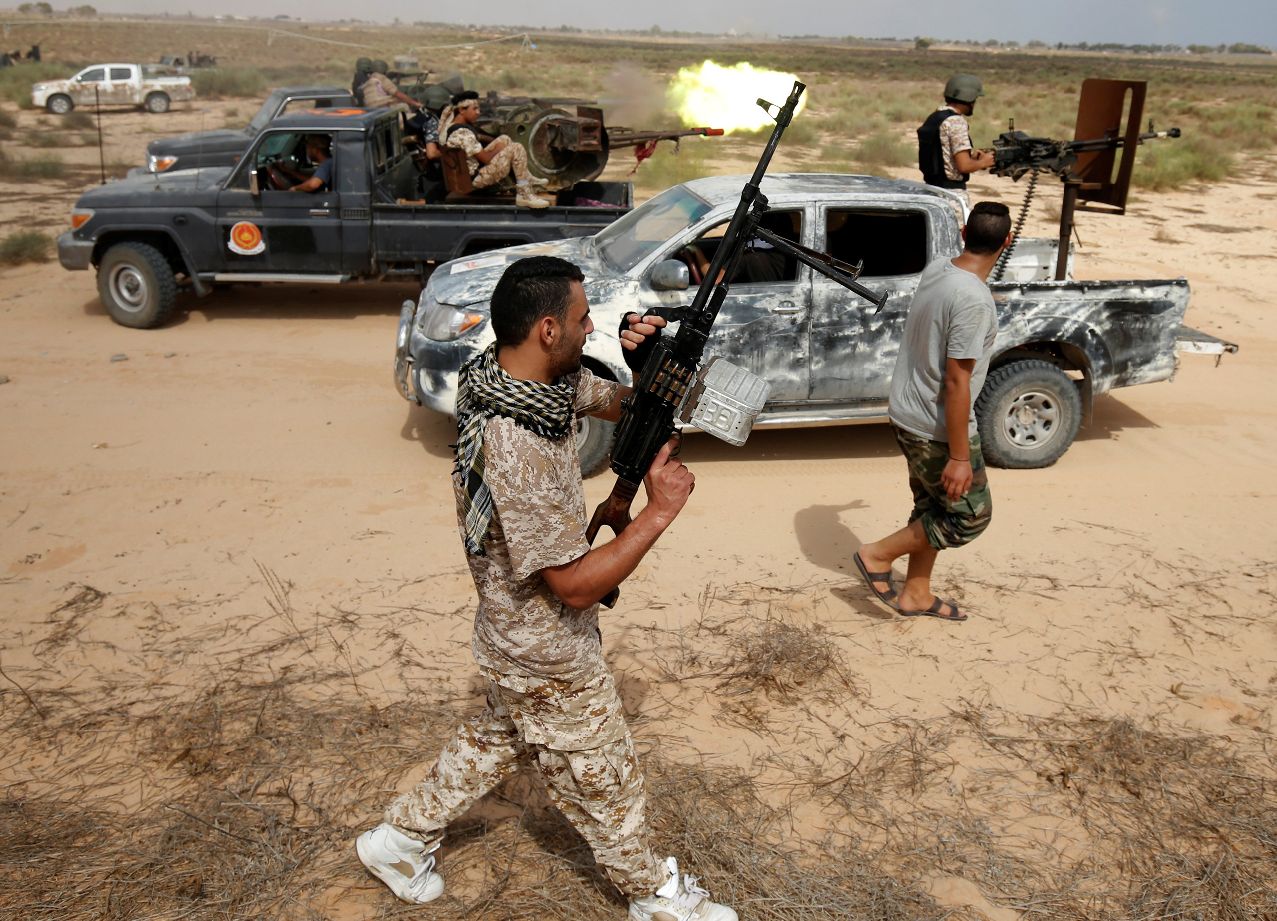 Libyan forces allied with the U.N.-backed unity government fire weapons as they move towards ISIS fighters' positions in Sirt, Libya, on July 15, 2016.