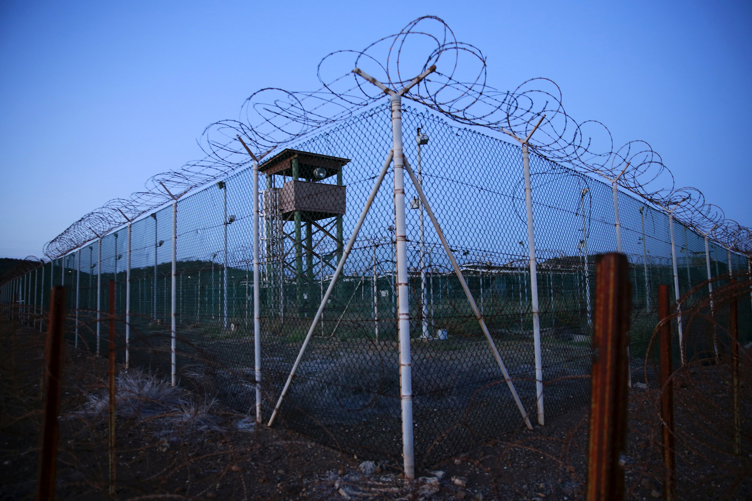 Chain-link fence and concertina wire surrounds a deserted guard tower within Joint Task Force Guant&aacute;namo's Camp Delta at the U.S. naval base in Guant&aacute;namo Bay, Cuba, on March 21, 2016 (Lucas Jackson—Reuters)