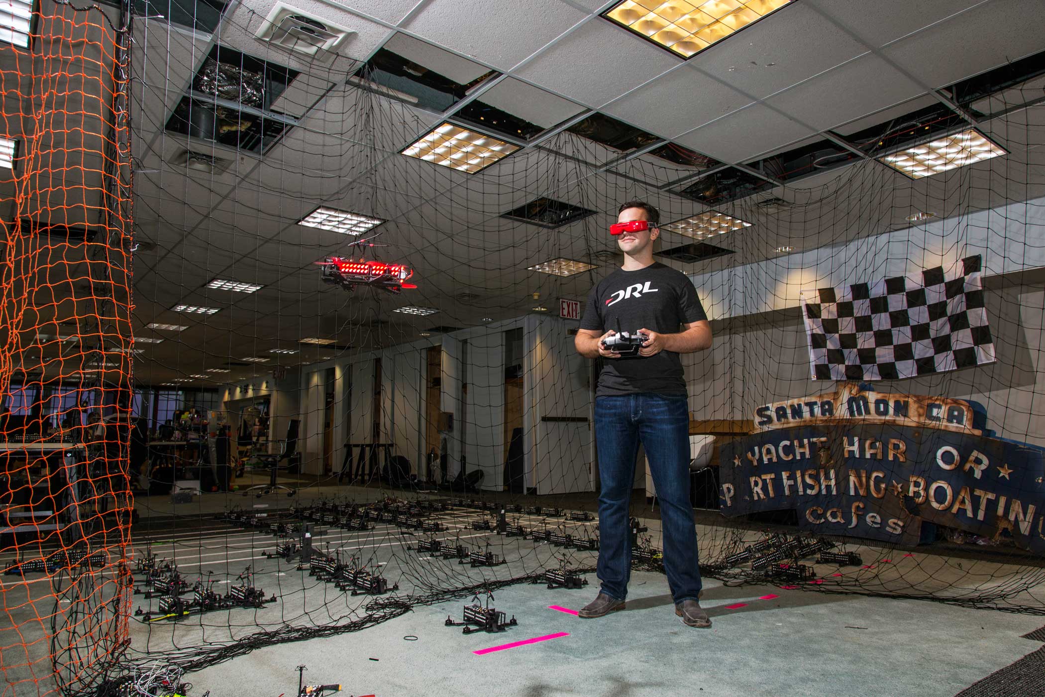 Drone Racing League CEO Nicholas Horbaczerski flys a drone in the DRL offices.