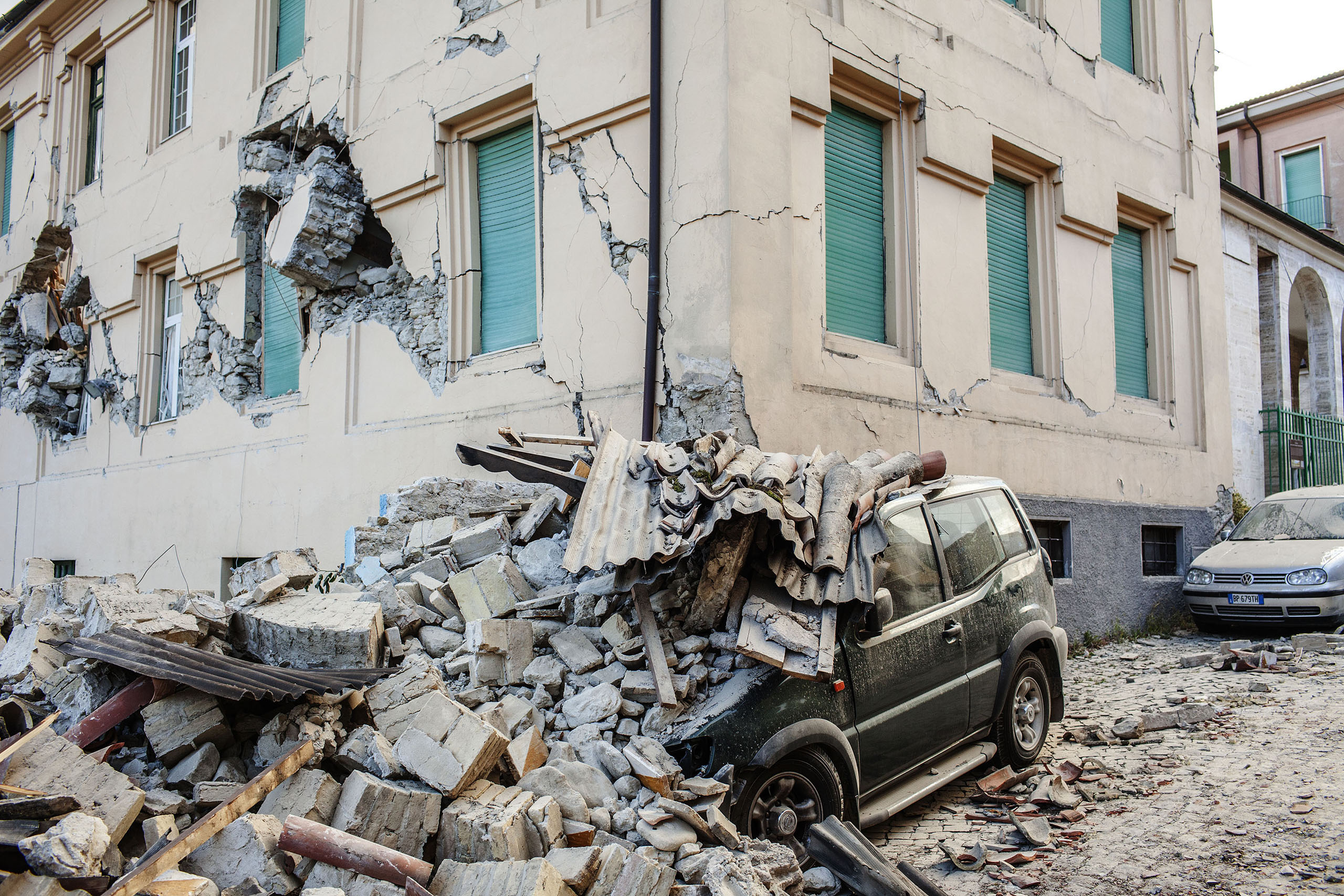 A car destroyed by the collapse of a house in Amatrice, Italy, on Aug. 24, 2016.