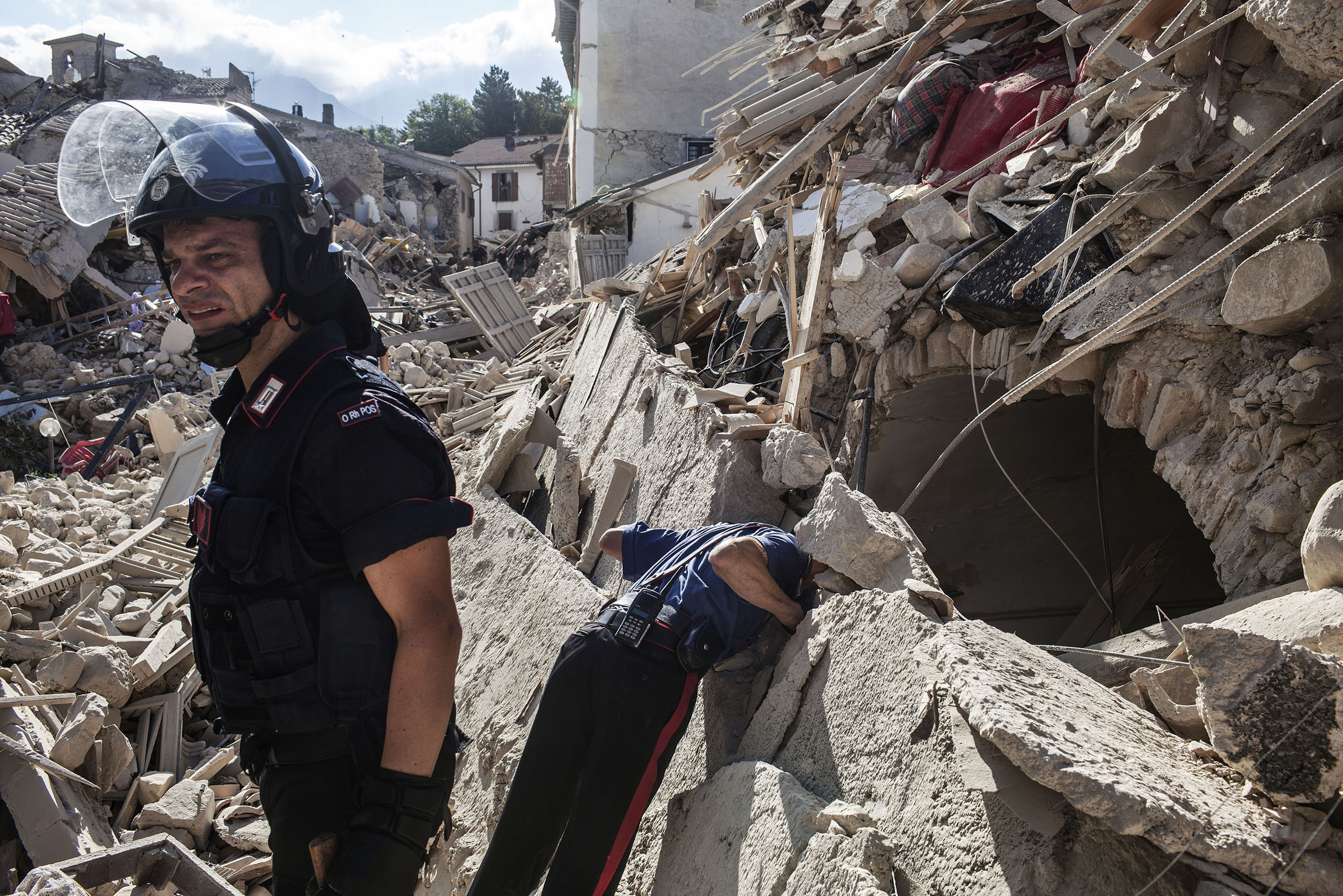 Authorities look for survivors in the rubble of the town of Amatrice, Italy, on Aug. 24, 2016.