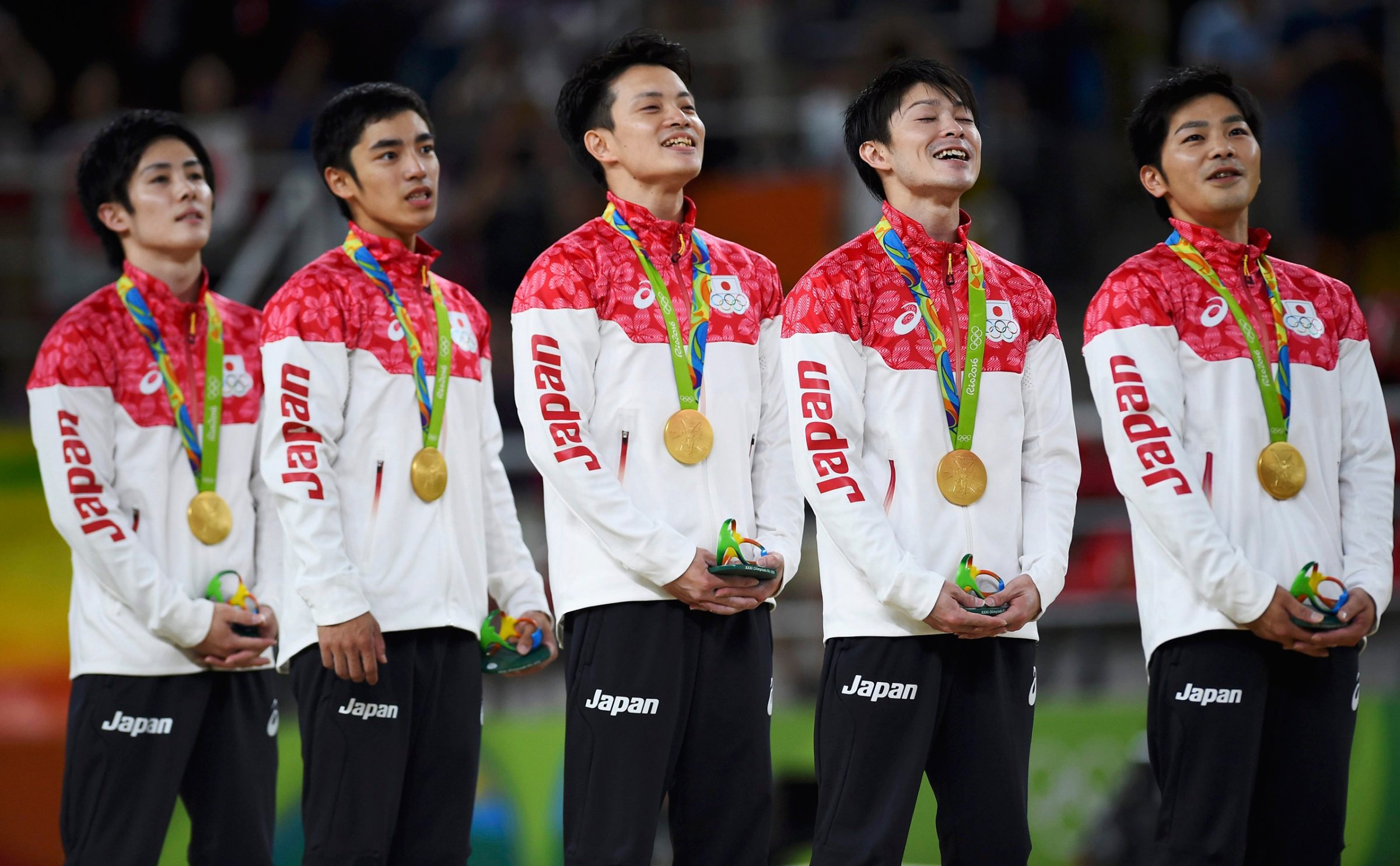 2016 Rio Olympics - Artistic Gymnastics - Final - Men's Team Final - Rio Olympic Arena - Rio de Janeiro, Brazil - 08/08/2016. (L-R) Ryohei Kato (JPN) of Japan, Kenzo Shirai (JPN) of Japan, Yusuke Tanaka (JPN) of Japan, Kohei Uchimura (JPN) of Japan, Koji Yamamuro (JPN) of Japan on the podium with their gold medals after winning the men's team final. REUTERS/Dylan Martinez TPX IMAGES OF THE DAY FOR EDITORIAL USE ONLY. NOT FOR SALE FOR MARKETING OR ADVERTISING CAMPAIGNS.
