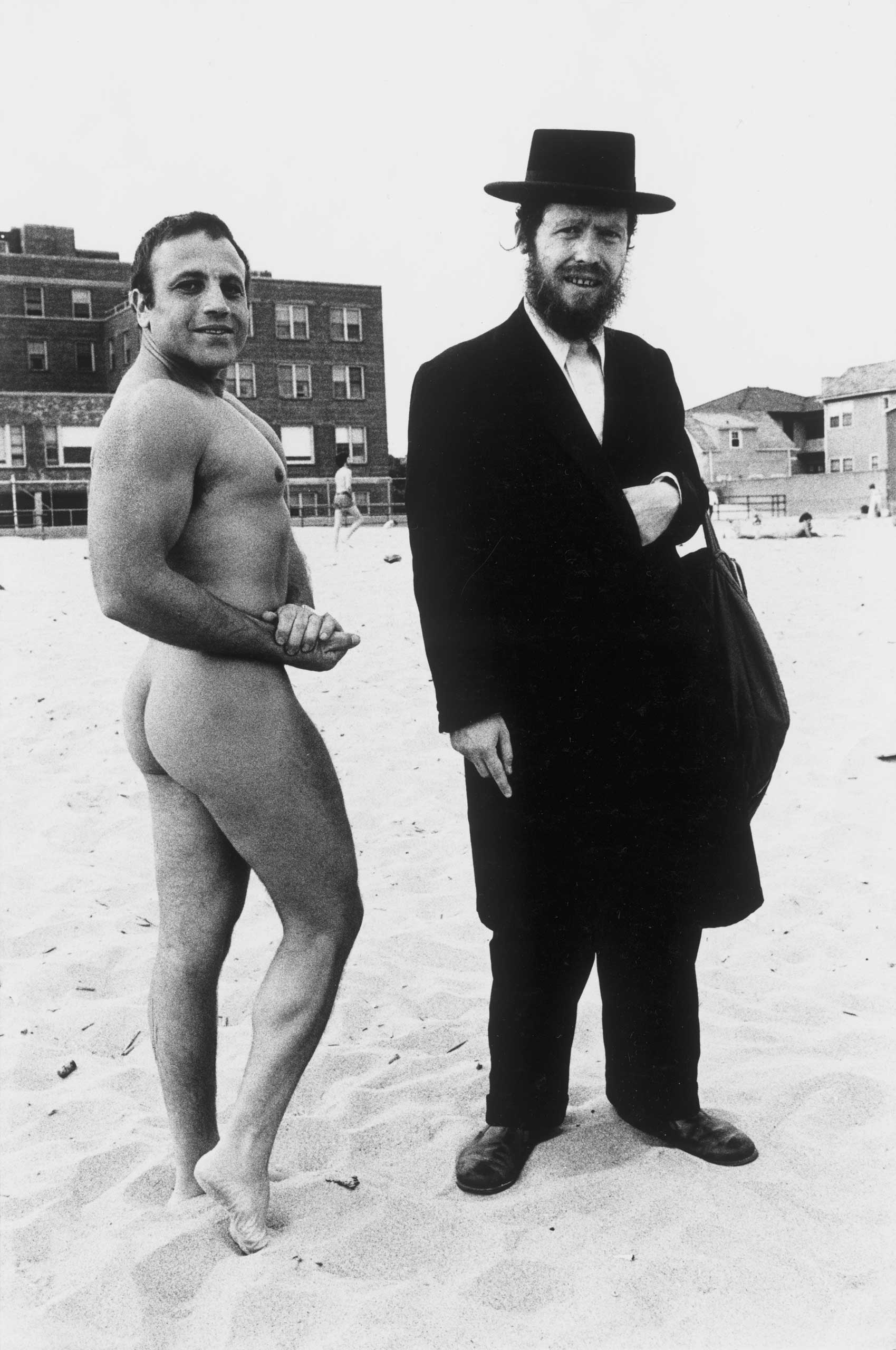 Hassid and Jewish Bodybuilder, 1980"The man showed up on Riis beach when there still was a nude bay and all the people started gathering around him. A nude man walks up to him and says take my picture with him becuase I am Jewish too!"