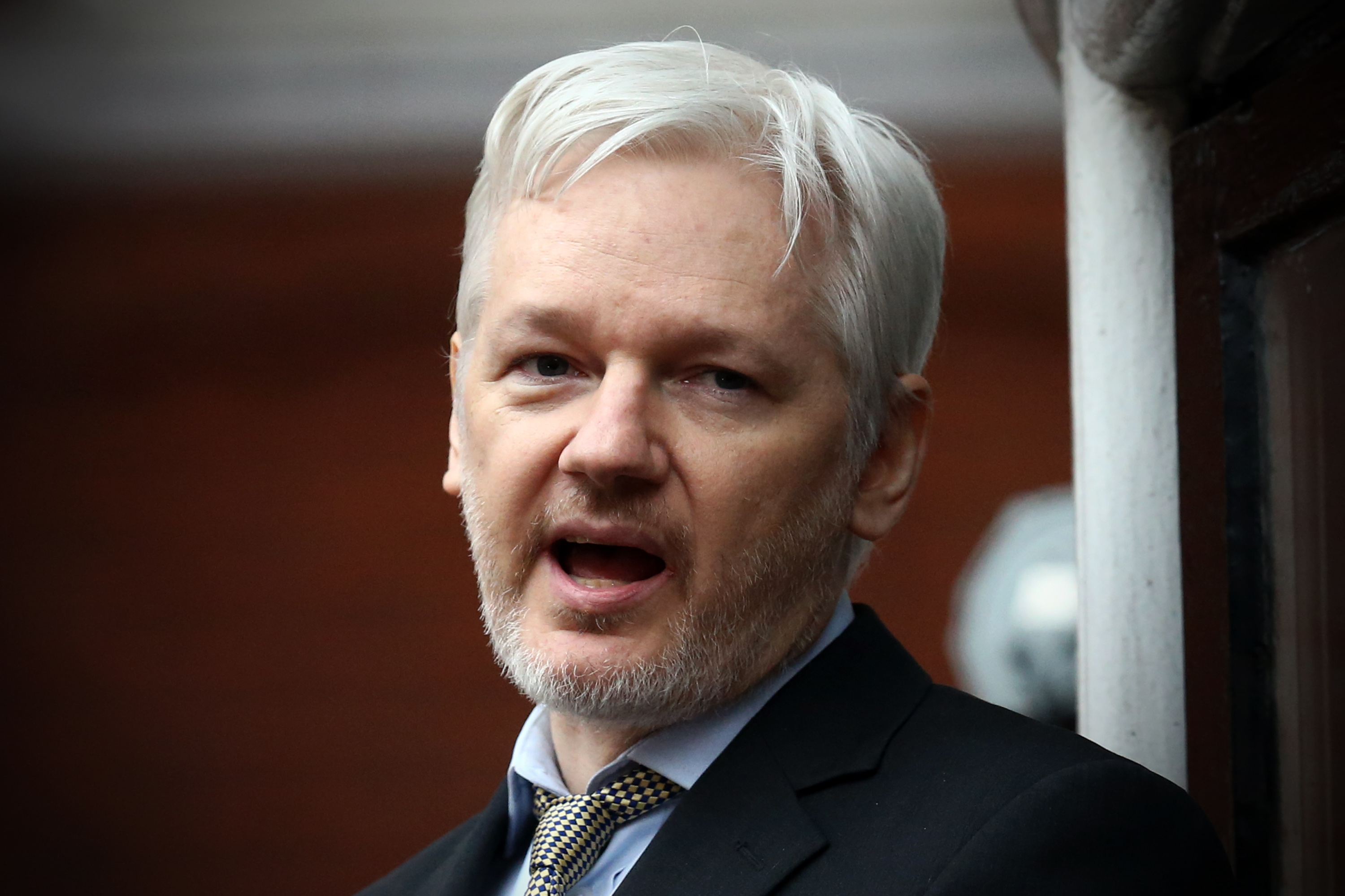 Wikileaks founder Julian Assange speaks from the balcony of the Ecuadorian embassy where  he continues to seek asylum following an extradition request from Sweden in 2012, on Feb. 5, 2016 in London, England. (Carl Court/Getty Images)