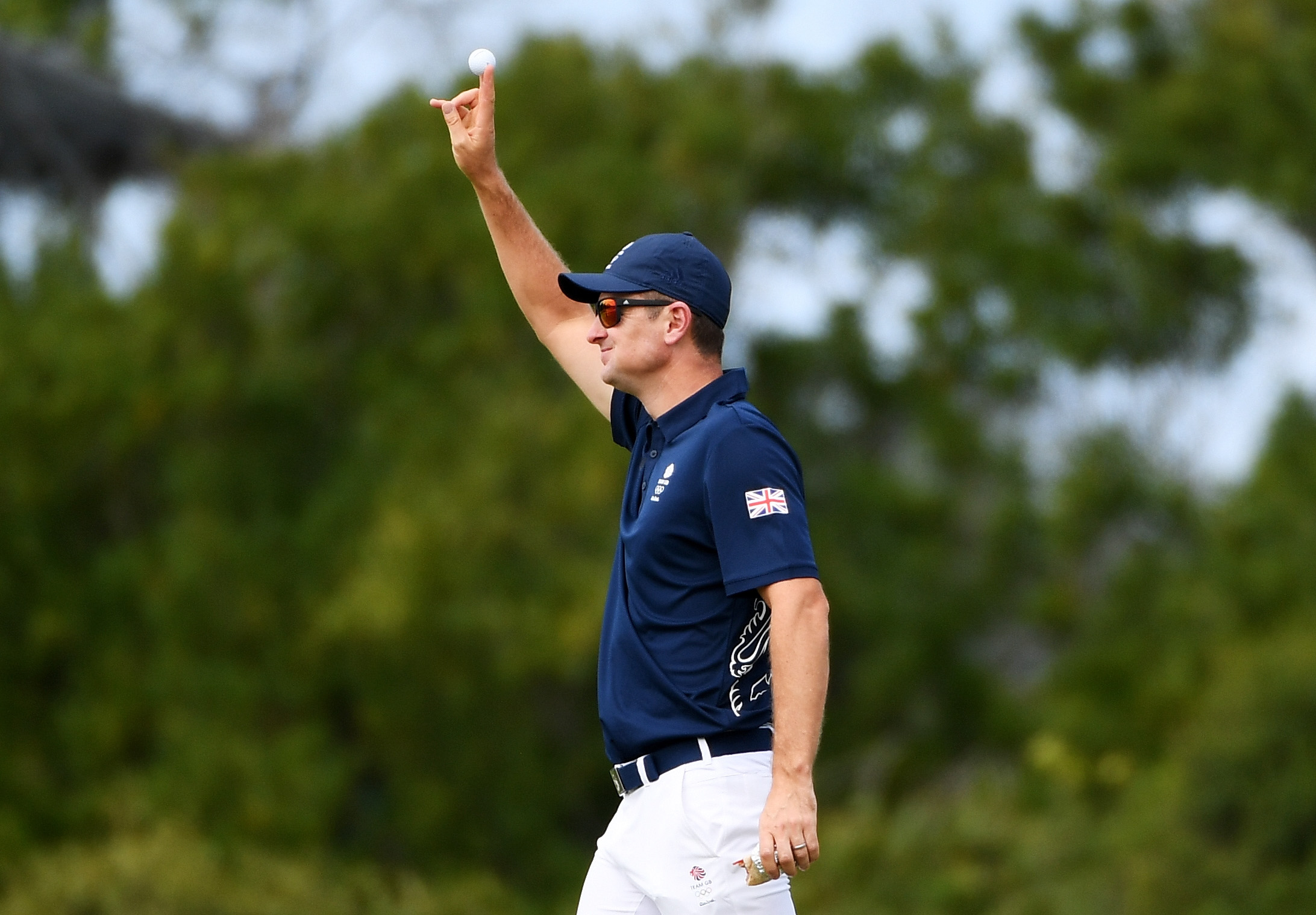 Justin Rose of Great Britain celebrates his hole in one on the fourth green during the first round of men's golf on Day 6 of the Rio 2016 Olympics at the Olympic Golf Course on August 12, 2016 in Rio de Janeiro, Brazil. (Ross Kinnaird—;Getty Images)