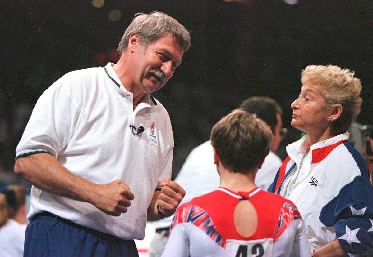 Coach Bela Karolyi (L) and wife Martha Karolyi show their delight with the performance of their protege Kerri Strug in the US Gymnastics Olympics Trials at the Fleet Center in Boston on June 30, 1996 (Doug Pensinger—Getty Images)