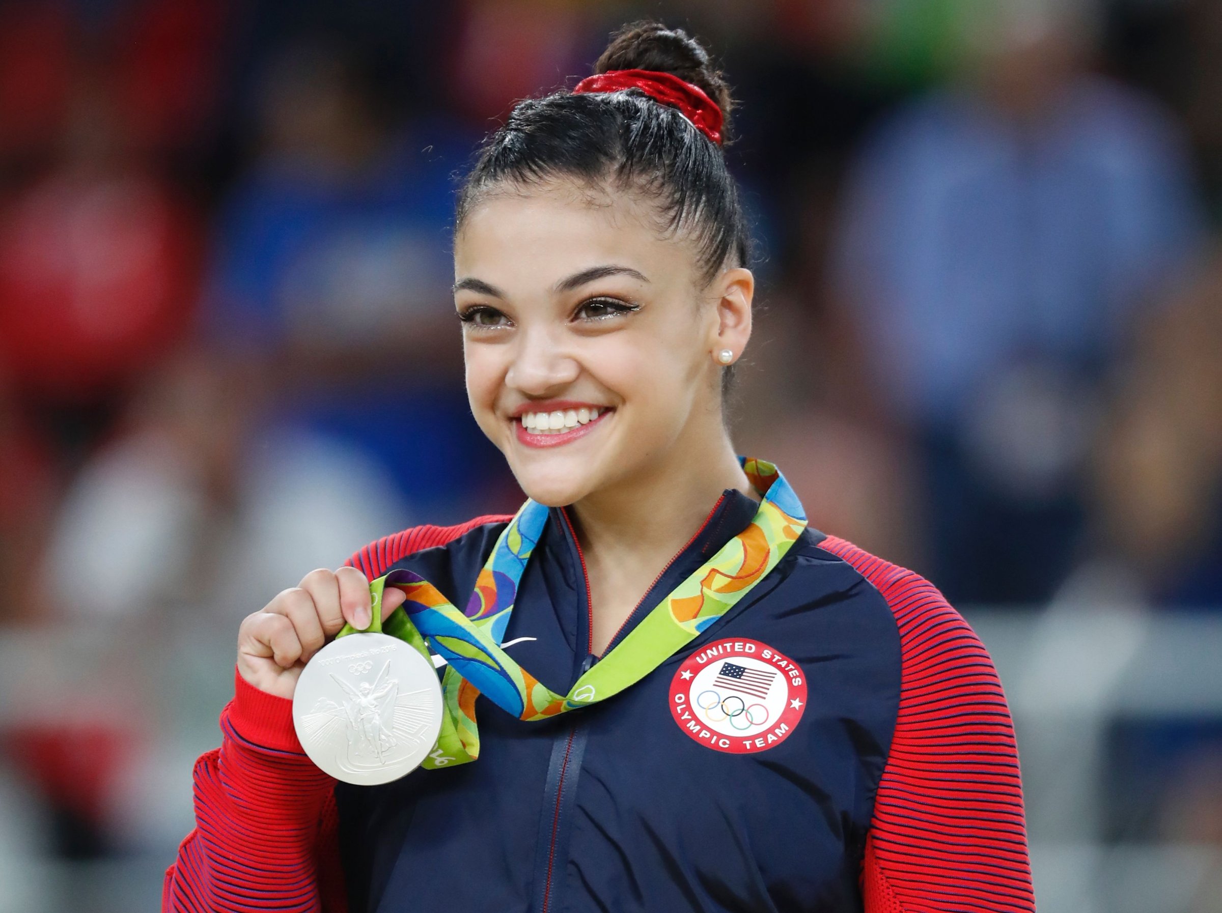 Silver medallist US gymnast Lauren Hernandez celebrates on the podium of the women's balance beam event final of the Artistic Gymnastics at the Olympic Arena during the Rio 2016 Olympic Games in Rio de Janeiro on August 15, 2016.