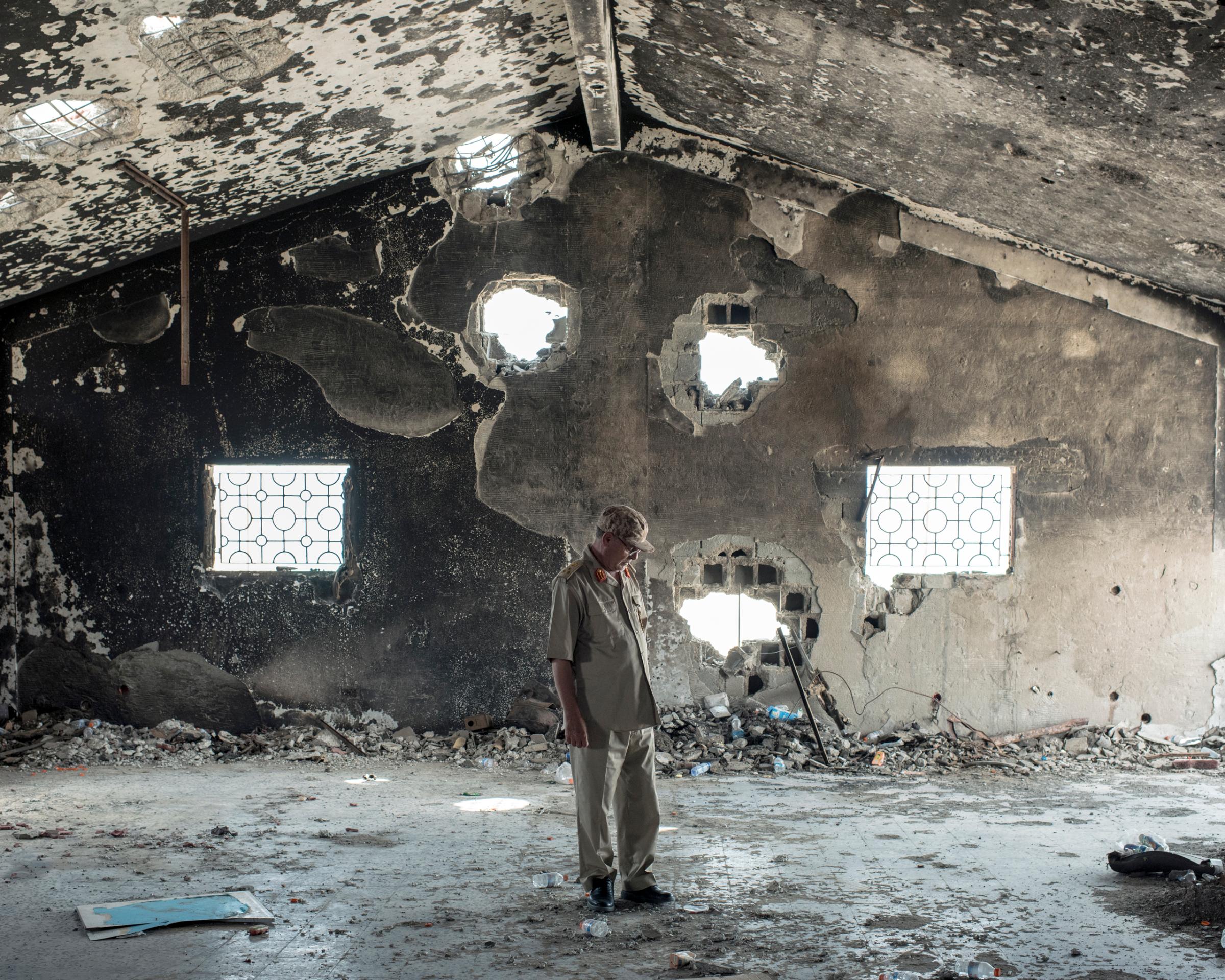 General-Brigadier Mohamed Al-Ghossri surveys the damage an ISIS suicide bomb wreaked upon a field hospital, Sirt, Libya, July 2016.