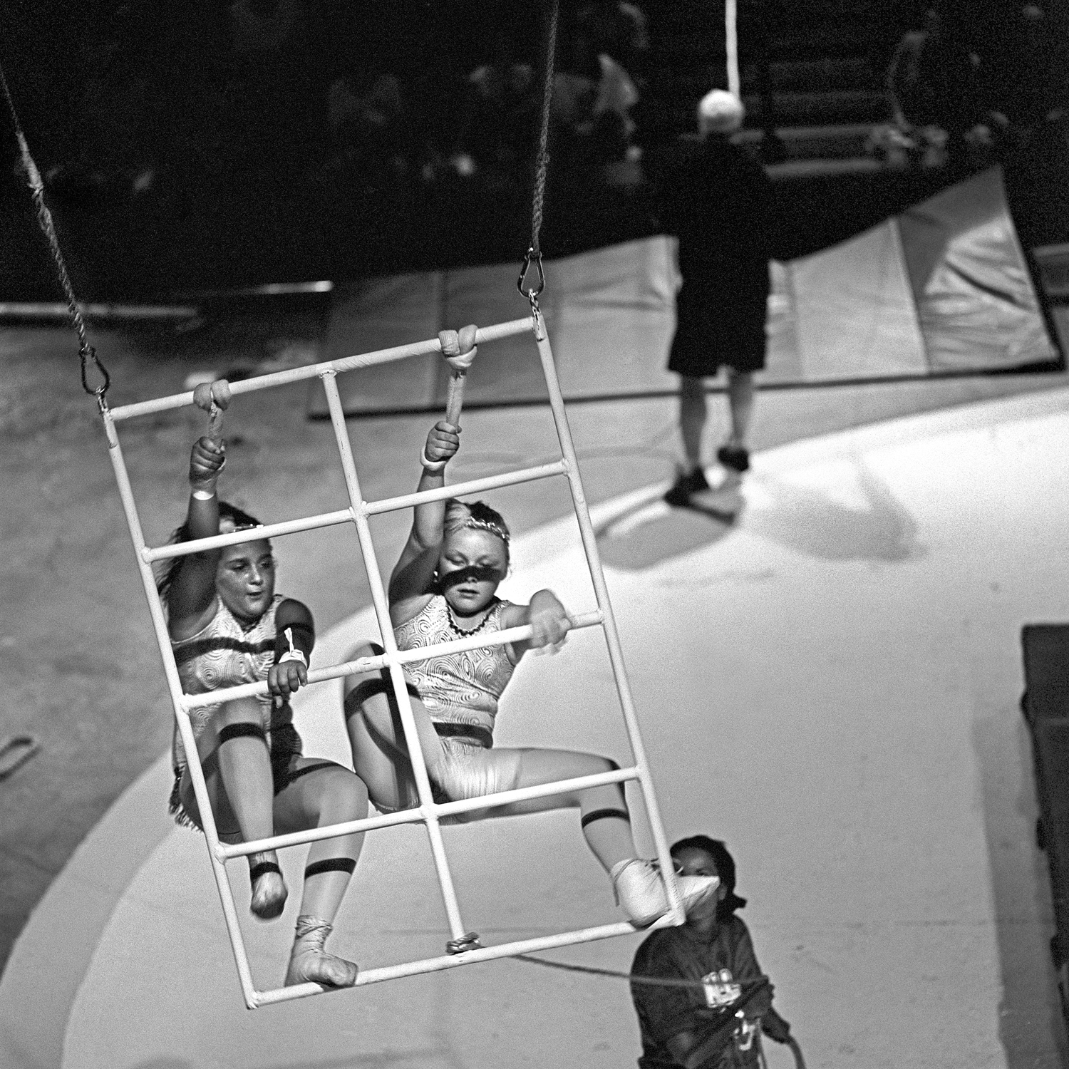 Swinging ladders is an act performed by 8-10 year olds. Spotters control the speed of the swing and keep close watch over the young performers.