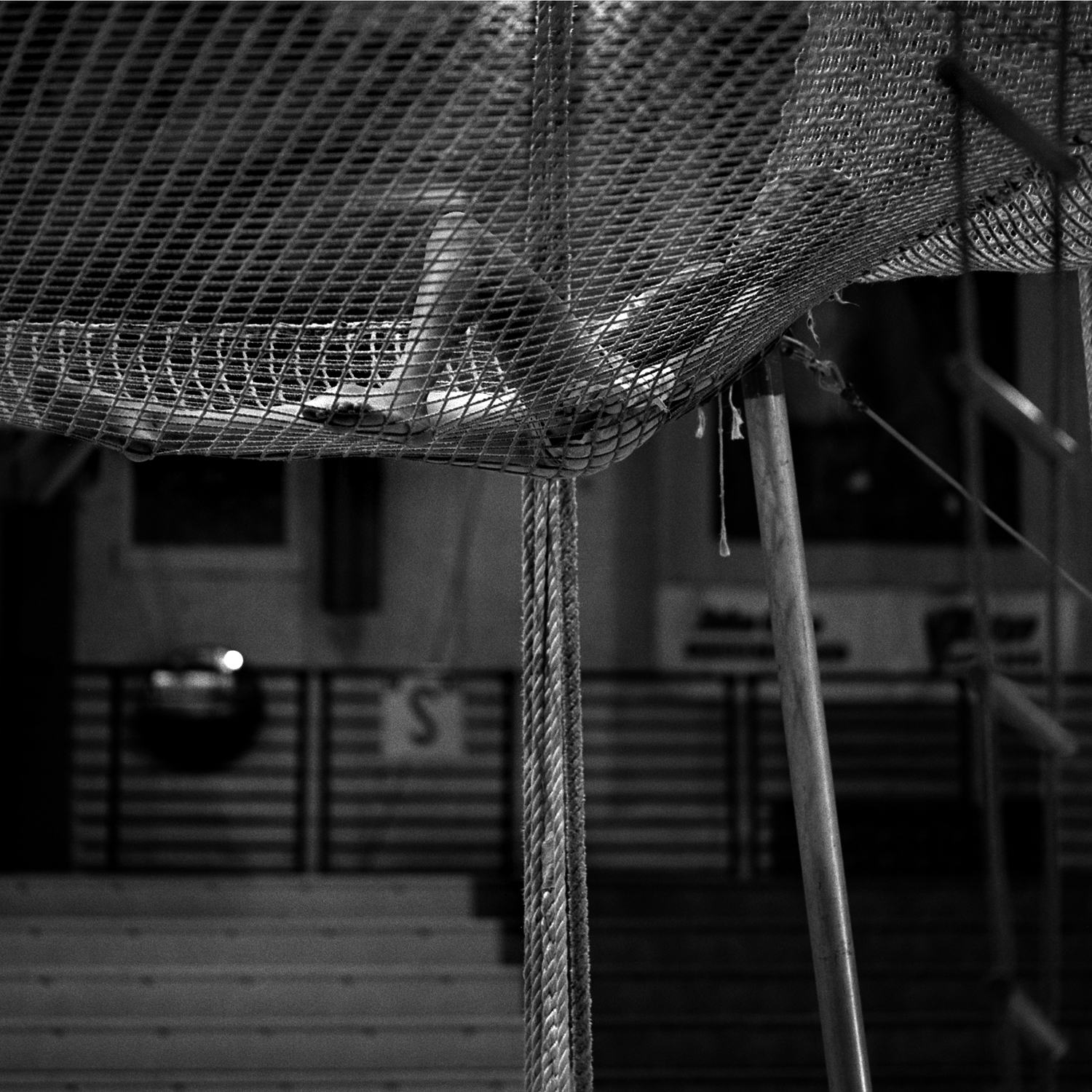 Josie Murphy, 13, rests between practice sessions. Josie is a third generation flying trapeze performer, one of a number of families whose participation spans generations. The following year she could no longer perform because basketball presented a scheduling conflict.