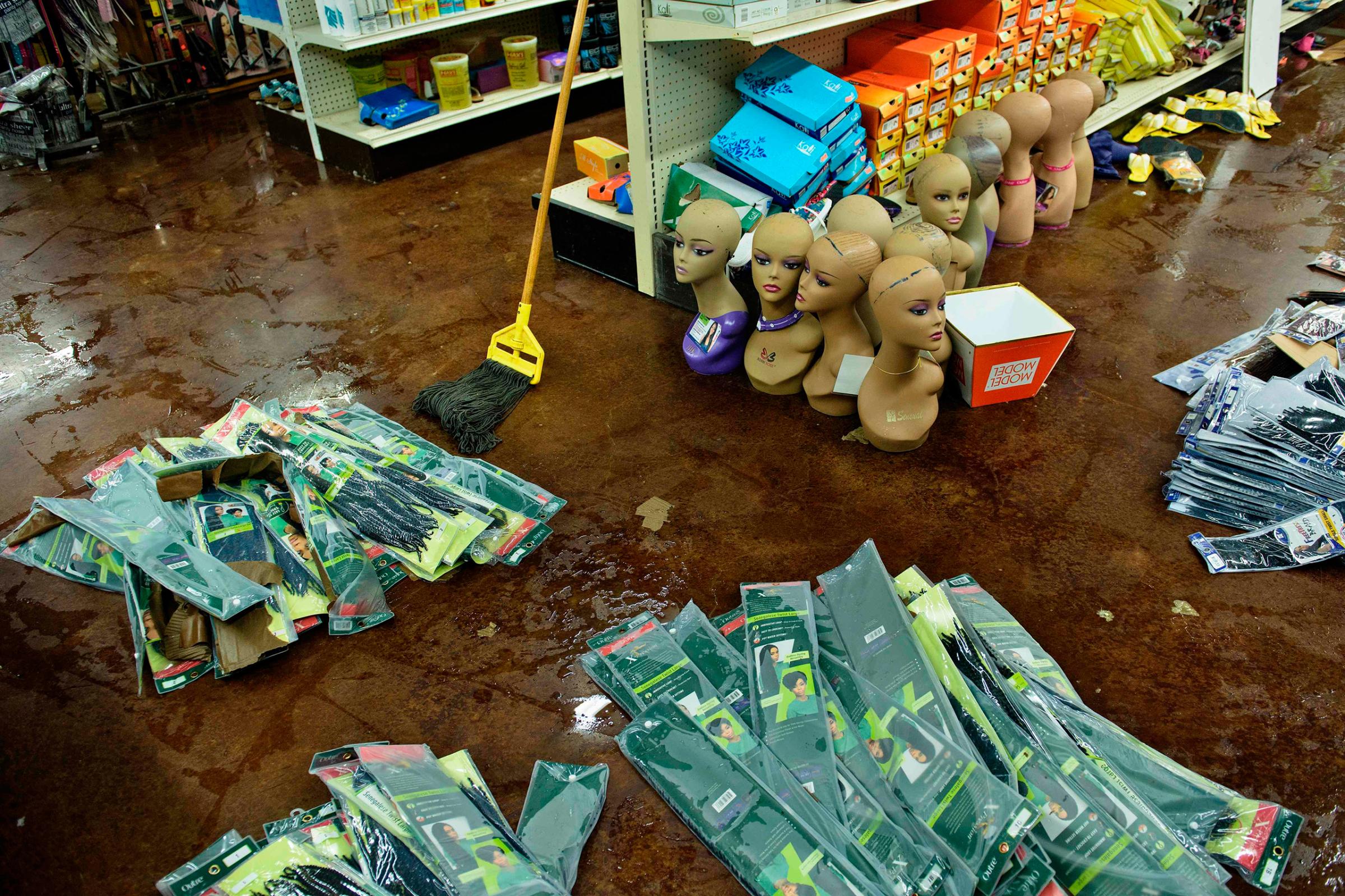 Damaged products are seen at Jasmine's Beauty Supply following the floods in Baton Rouge, La., on Aug. 16, 2016.