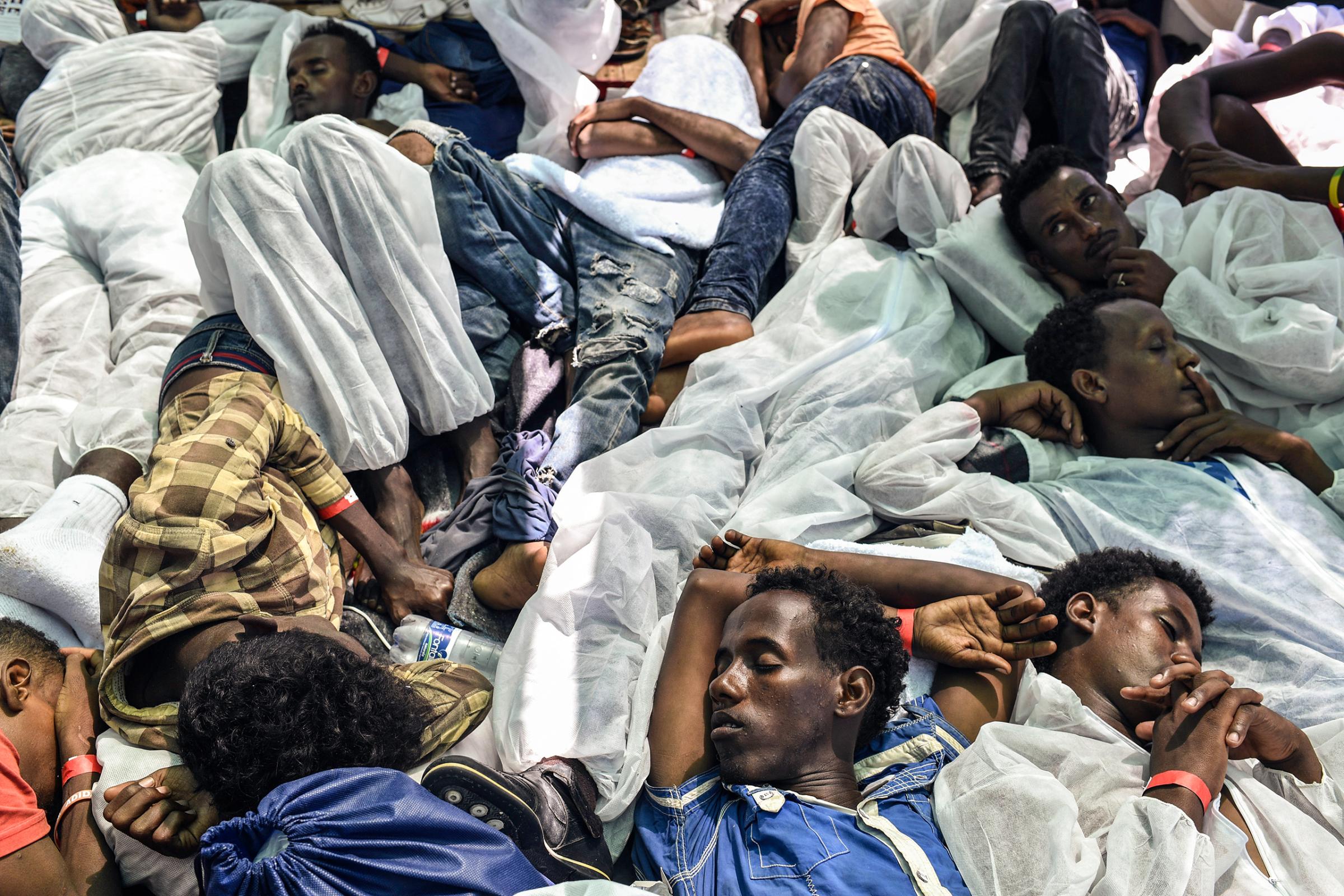 A group of men sleep on MV Aquarius ship after being rescued by search-and-rescue teams jointly operated by Médecins Sans Frontières and SOS Méditerranée, Aug. 21, 2016.