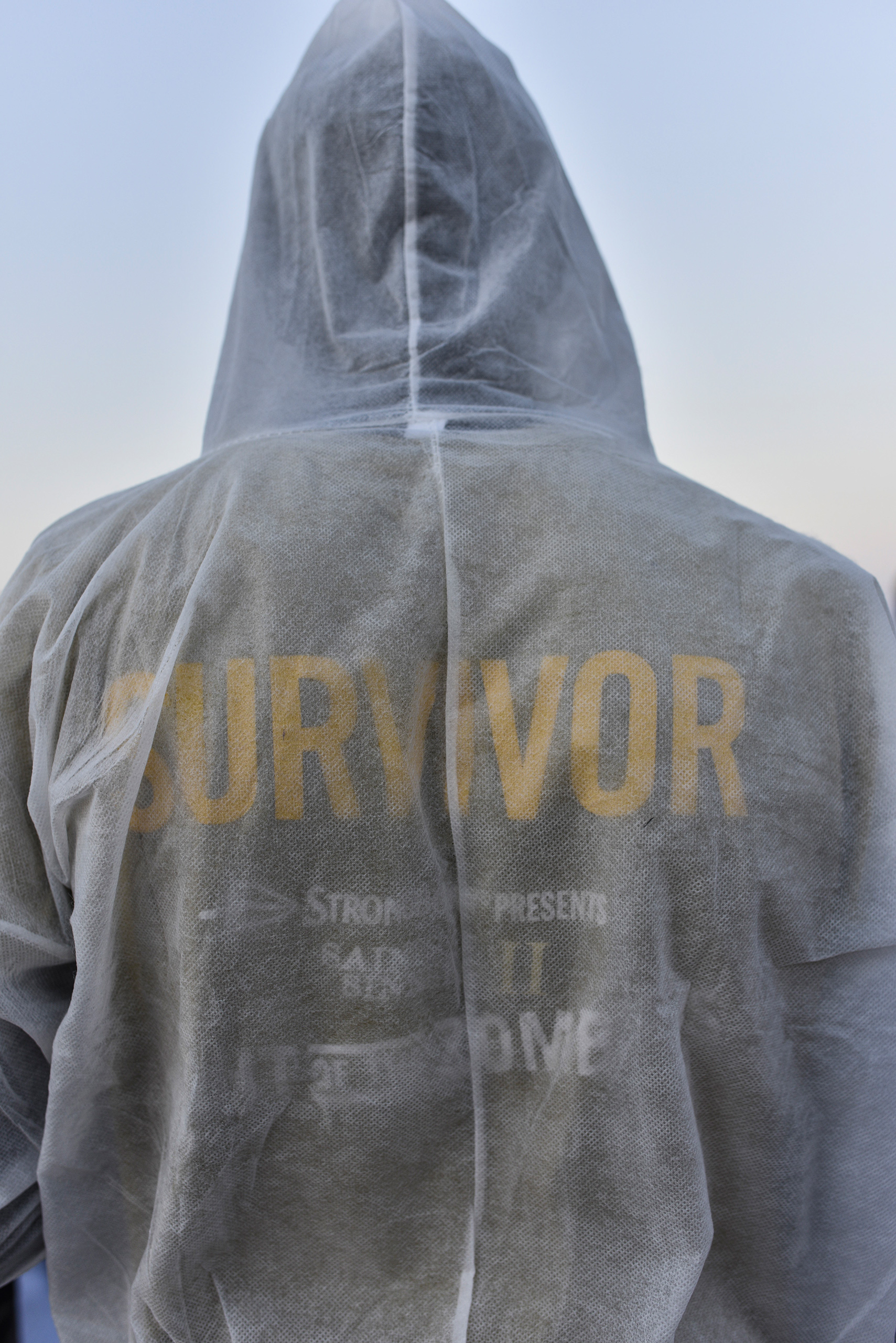A migrant wearing a "Survivor" shirt, Aug. 21, 2016.