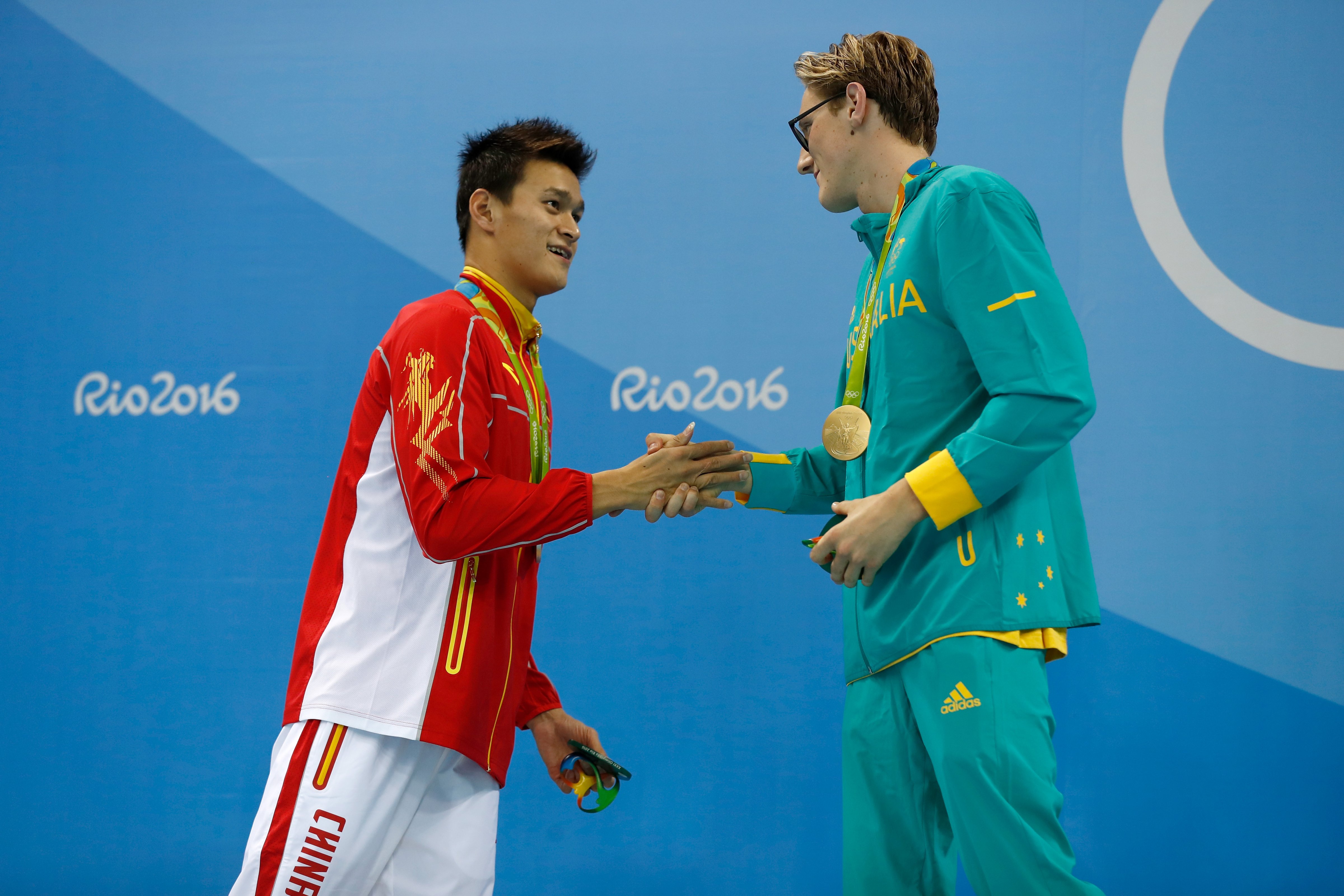 (L-R) Silver medalist Sun Yang of China and gold medal medallist Mack Horton of Australia pose during the medal ceremony for the Final of the Men's 400m Freestyle on Day 1 of the Rio 2016 Olympic Games at the Olympic Aquatics Stadium on August 6, 2016 in Rio de Janeiro, Brazil.