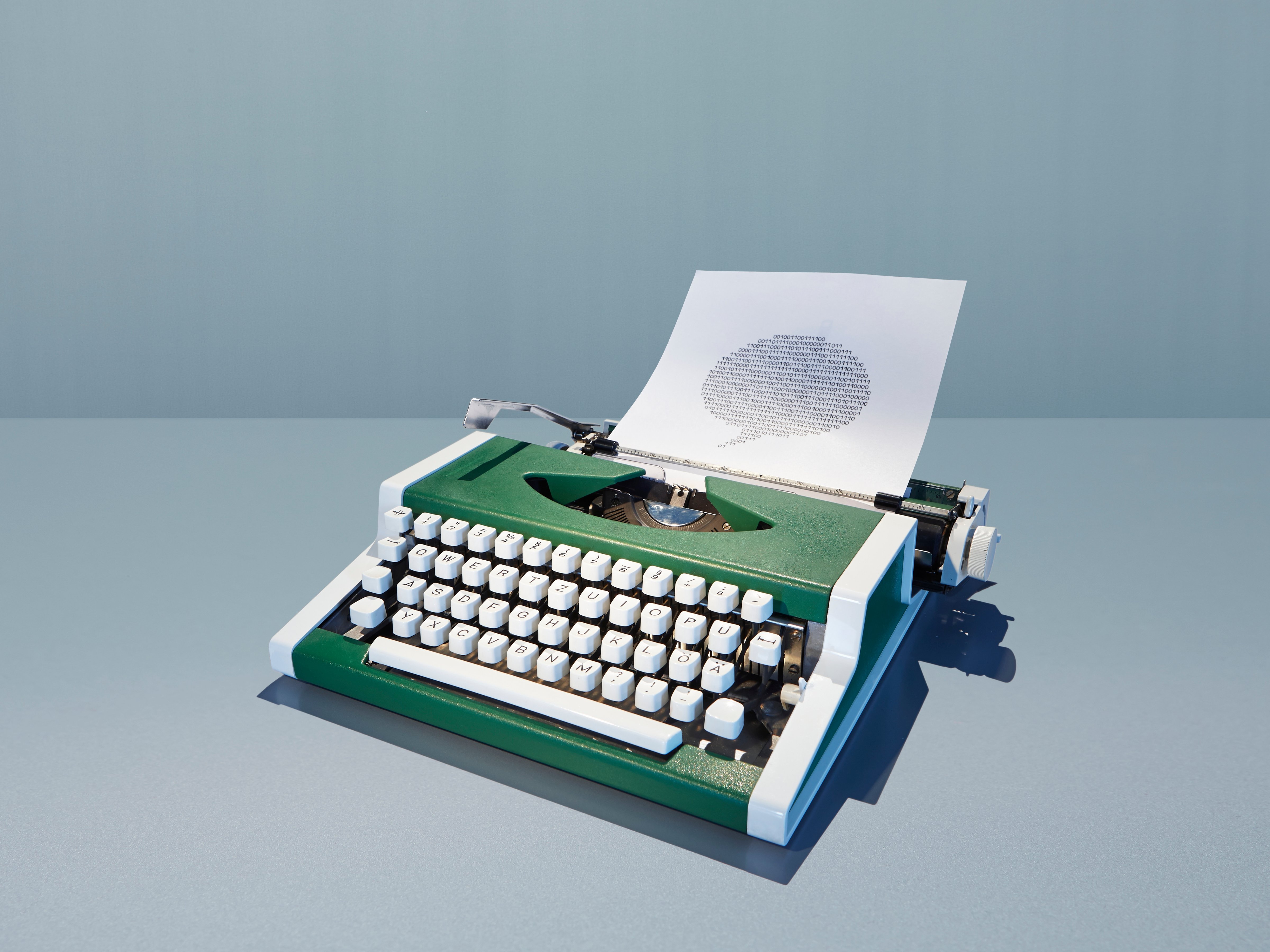 Retro typewriter printing speech bubble of binary digits (Getty Images)