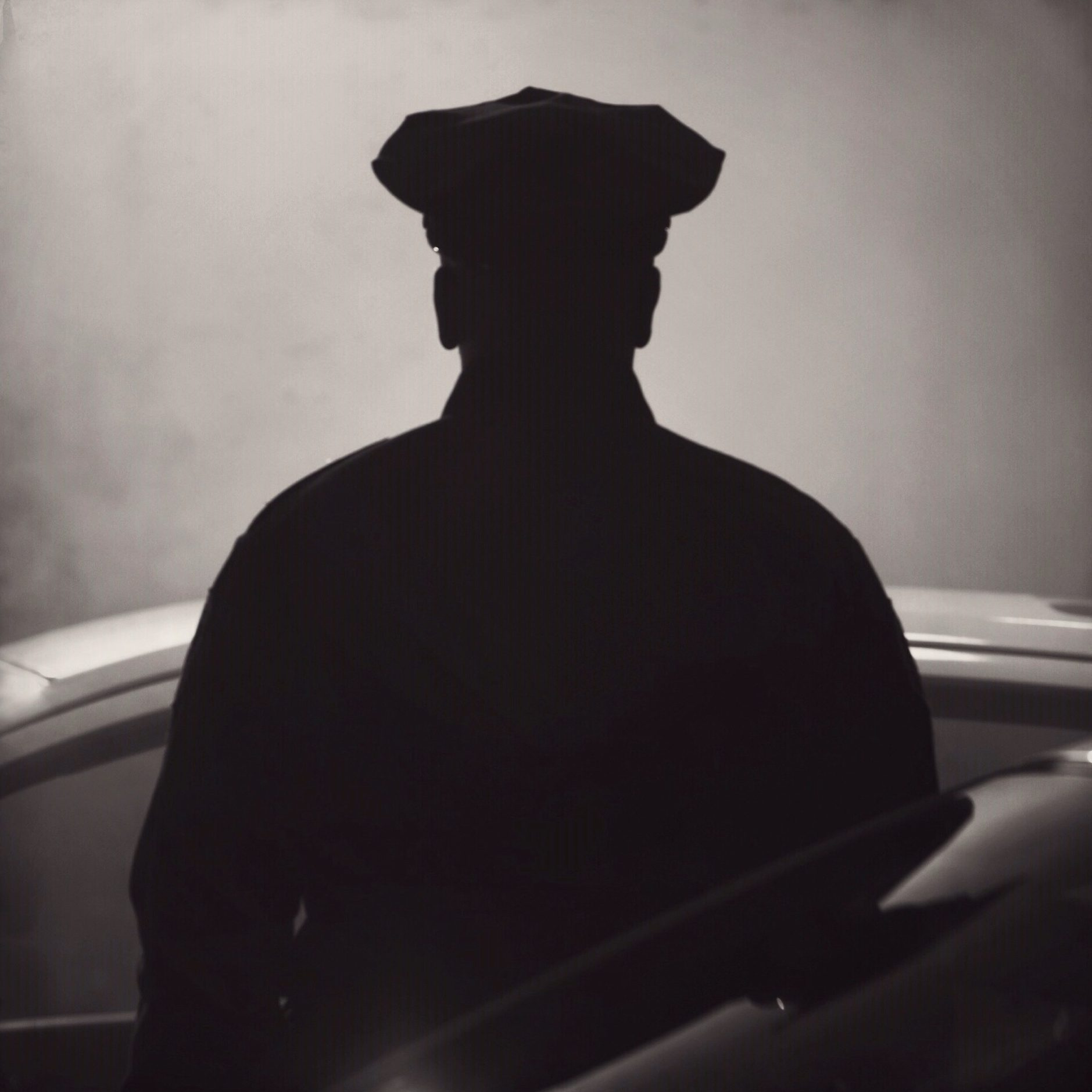 The silhouette of a police officer