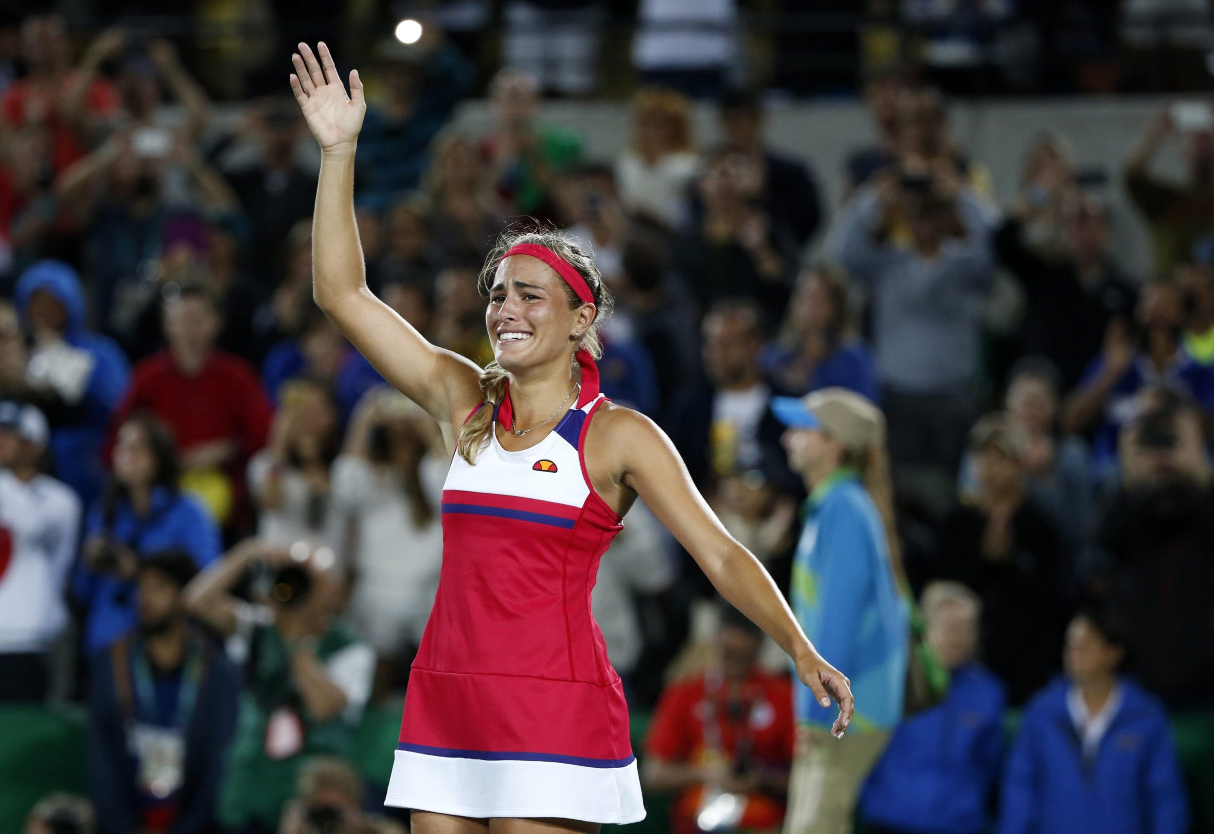 Monica Puig of Puerto Rico celebrates defeating Angelique Kerber of Germany during the women's Singles Gold medal match of the Rio 2016 Olympic Games Tennis events at the Olympic Tennis Centre in the Olympic Park in Rio de Janeiro on Aug. 13, 2016.