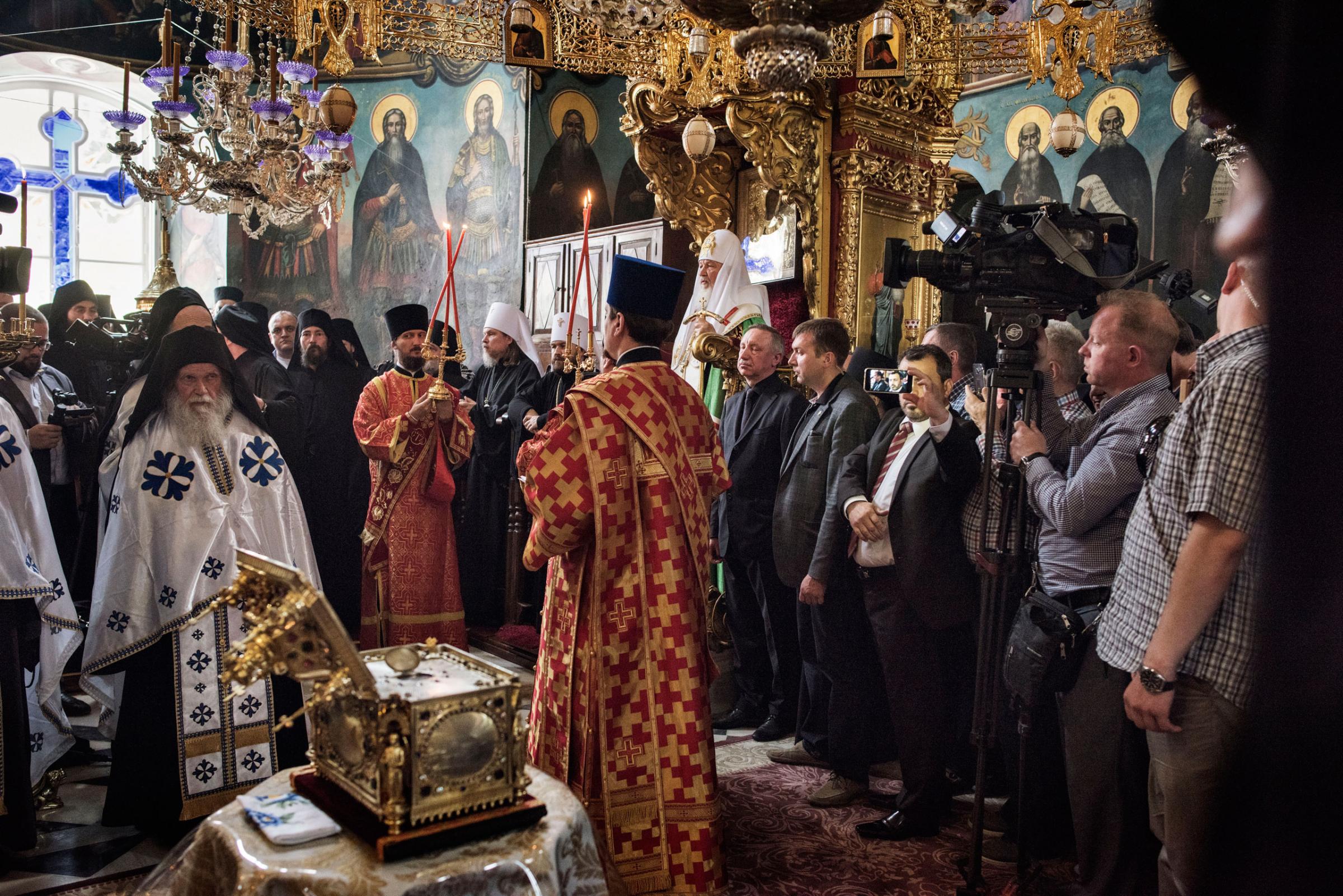 Patriarch Kirill (seated), the head of the Russian Orthodox Church, takes part in a prayer service at the Monastery of St. Panteleimon on Mount Athos, in northern Greece, May 27, 2016. Out of the 20 monasteries that comprise and govern the monastic community of Mount Athos, St. Panteleimon is the only one associated with the Russian Orthodox Church.