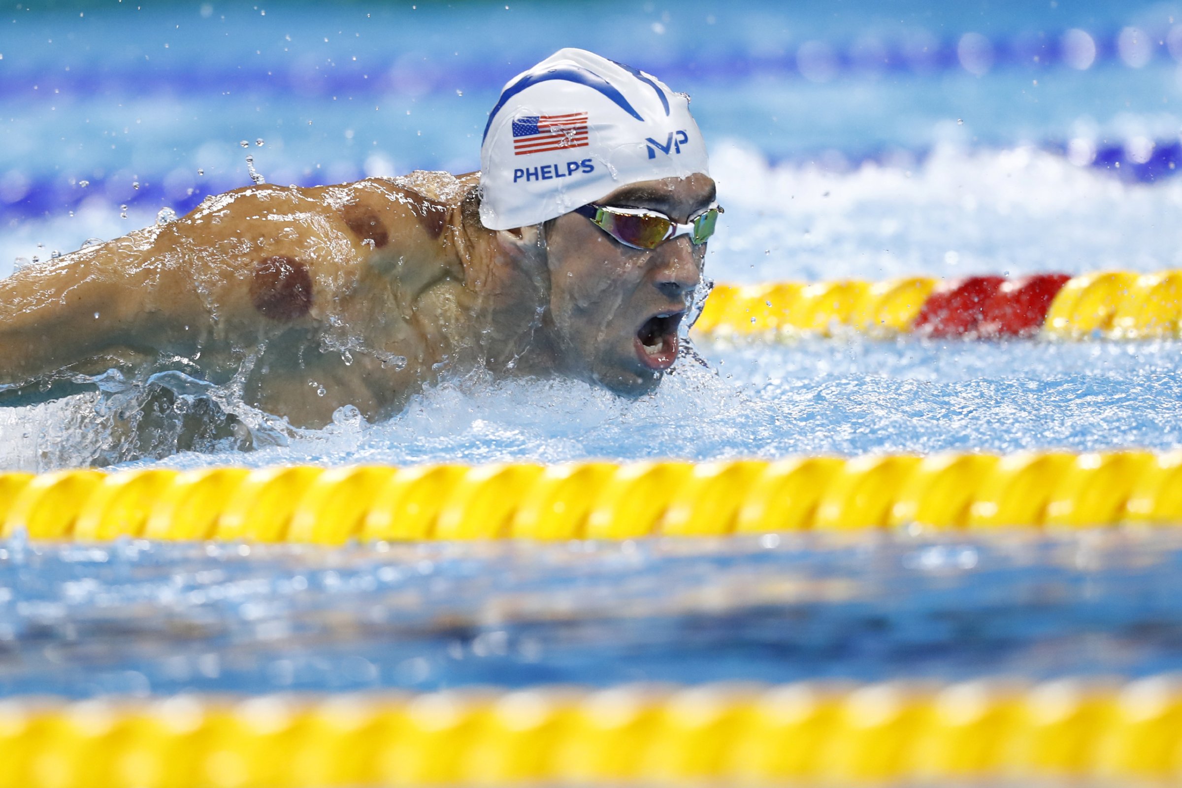 USA's Michael Phelps competes in a Men's 200m Butterfly heat during the swimming event at the Rio 2016 Olympic Games at the Olympic Aquatics Stadium in Rio de Janeiro on August 8, 2016. / AFP / Odd Andersen (Photo credit should read ODD ANDERSEN/AFP/Getty Images)
