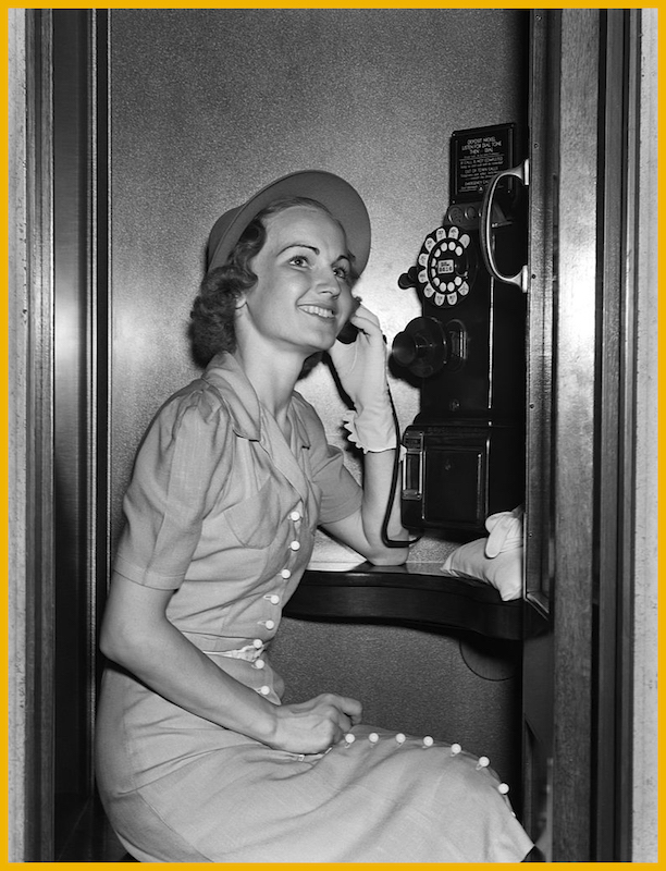 Woman using a pay phone circa 1930s (H. Armstrong Roberts—Retrofile/Getty Images)