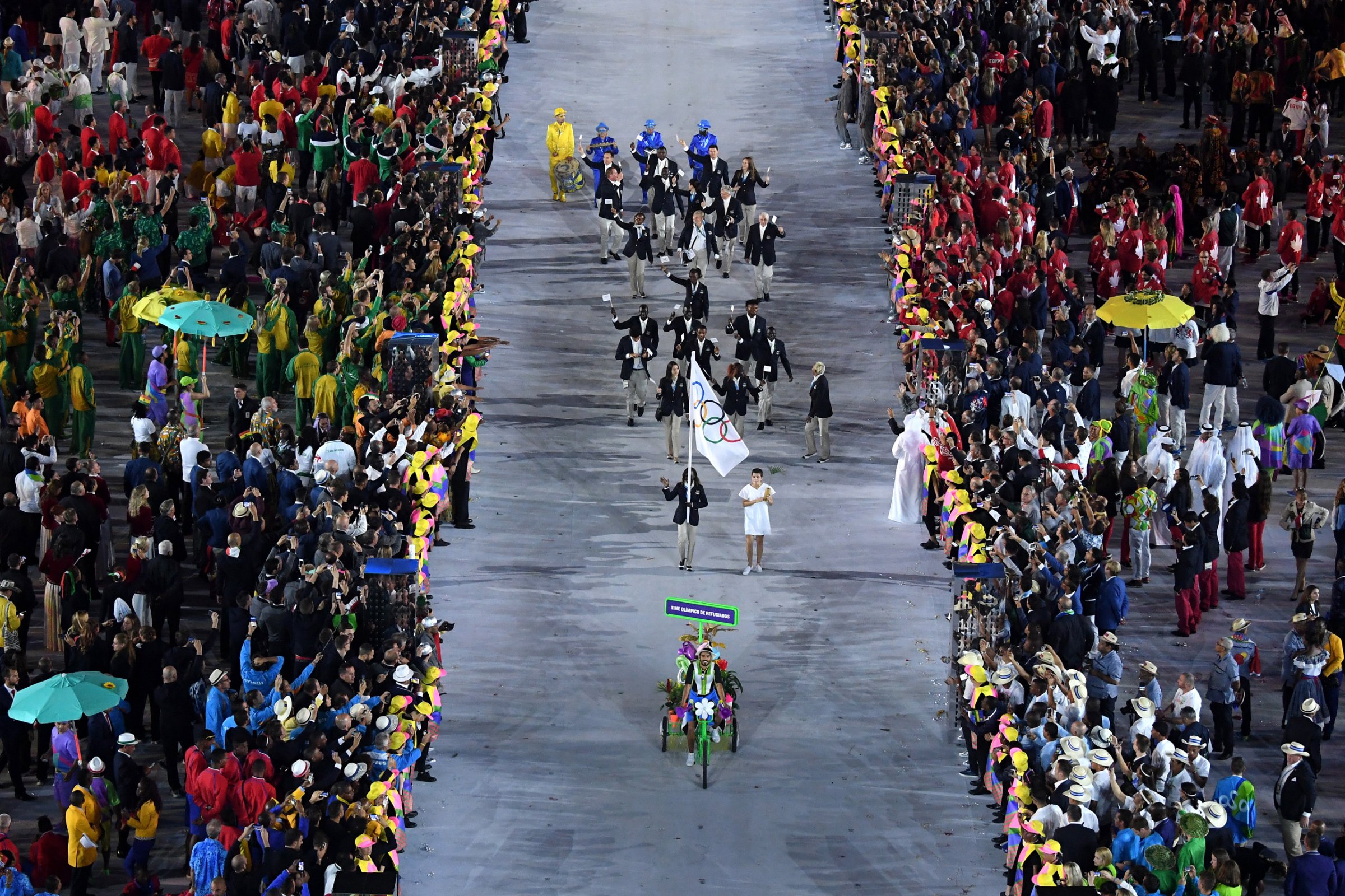 The Olympic Refugee team enter the atheletes parade during the Opening Ceremony of the Rio 2016 Olympic Games at Maracana Stadium in Rio de Janeiro on August 5, 2016.