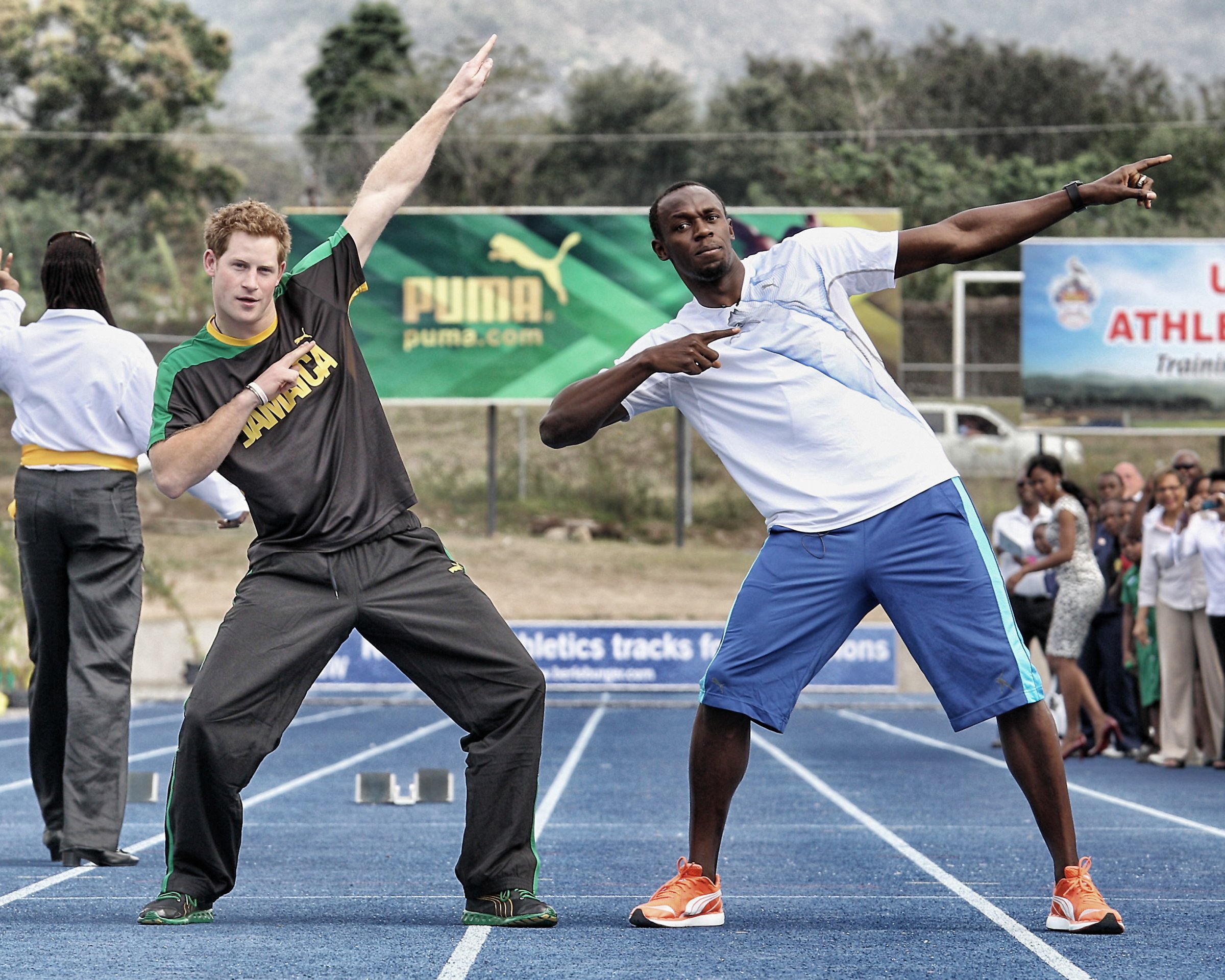 Prince Harry races Usain Bolt at the Usain Bolt Track at the University of the West Indies in Kingston, Jamaica on March 6, 2012.