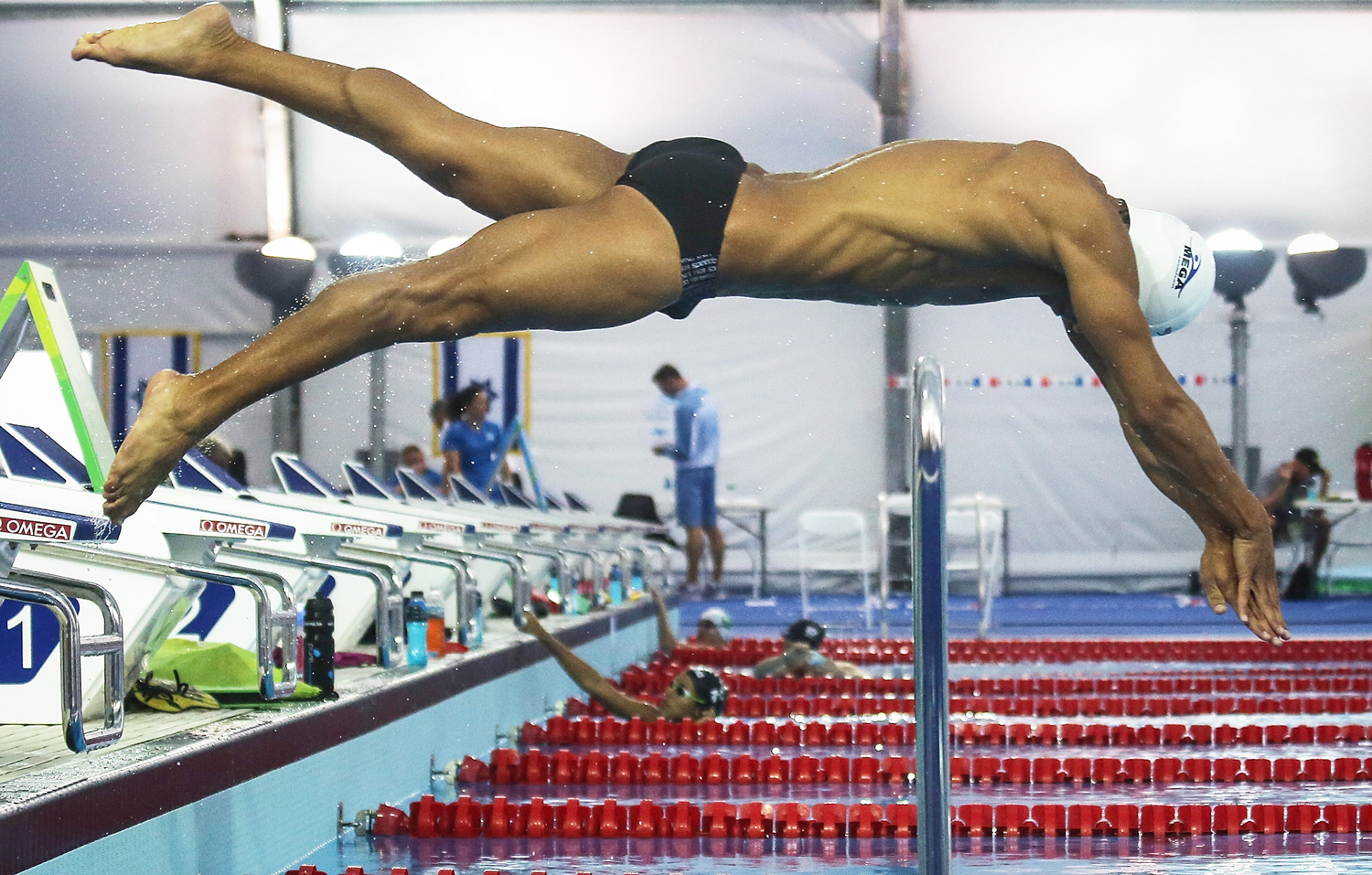 Rami Anis, an Olympic refugee team swimmer from Syria, dives while training at the Olympic Aquatics Stadium ahead of the opening ceremonies in Rio de Janeiro on July 28, 2016.