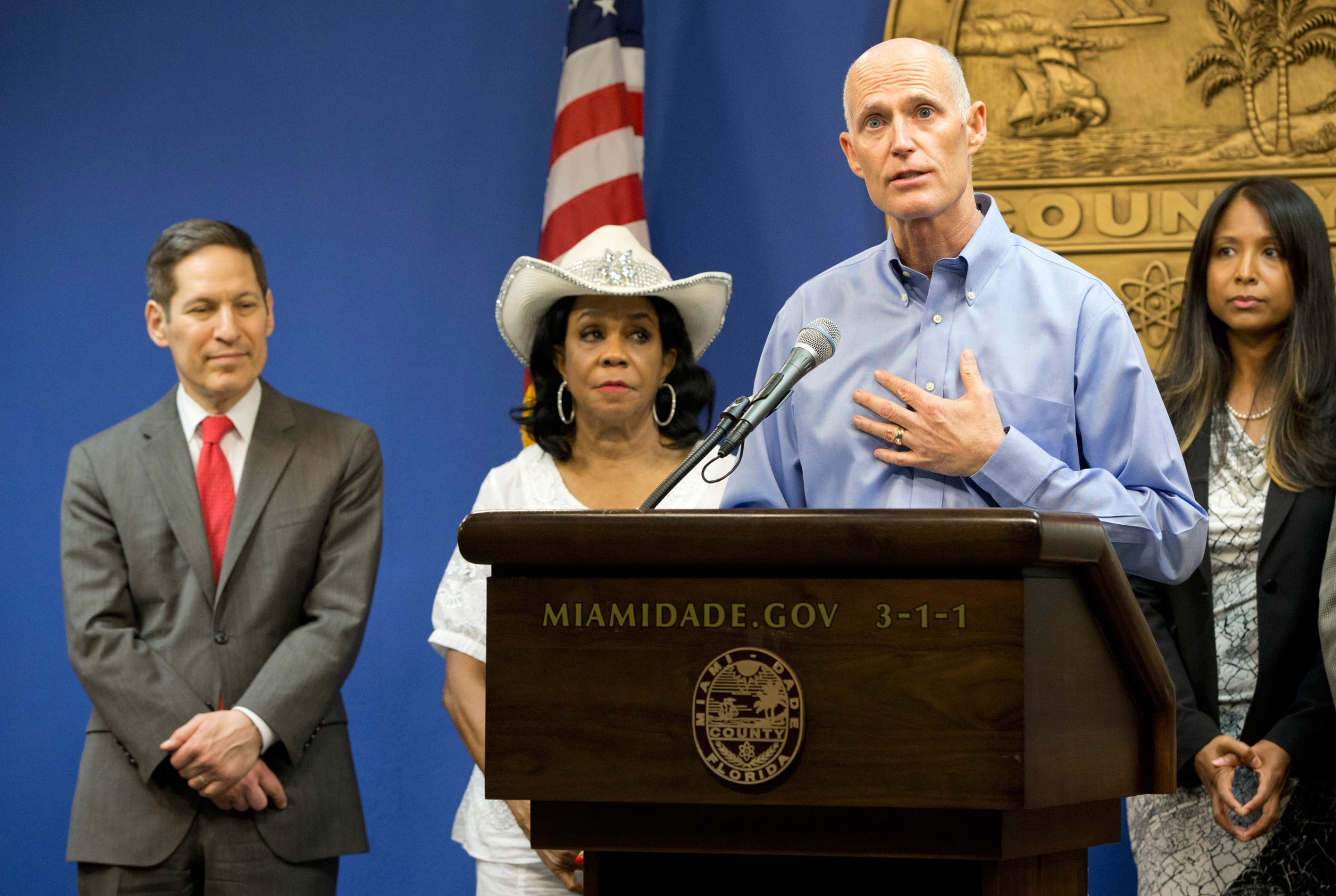 Florida Gov. Rick Scott, foreground, speaks during a news conference along with Centers for Disease Control and Prevention Director Dr. Tom Frieden, left, Rep. Frederica Wilson, D-FL, and Fla. Surgeon General and Secretary, Dr. Celeste Philip, far right, Thursday, Aug. 4, 2016, in Doral, Fla. The CDC has warned expectant mothers to steer clear of the city's Wynwood neighborhood, where at least 15 people are believed to have been infected with the Zika virus through mosquito bites in the first such cases on record in the mainland U.S. (AP Photo/Wilfredo Lee)
