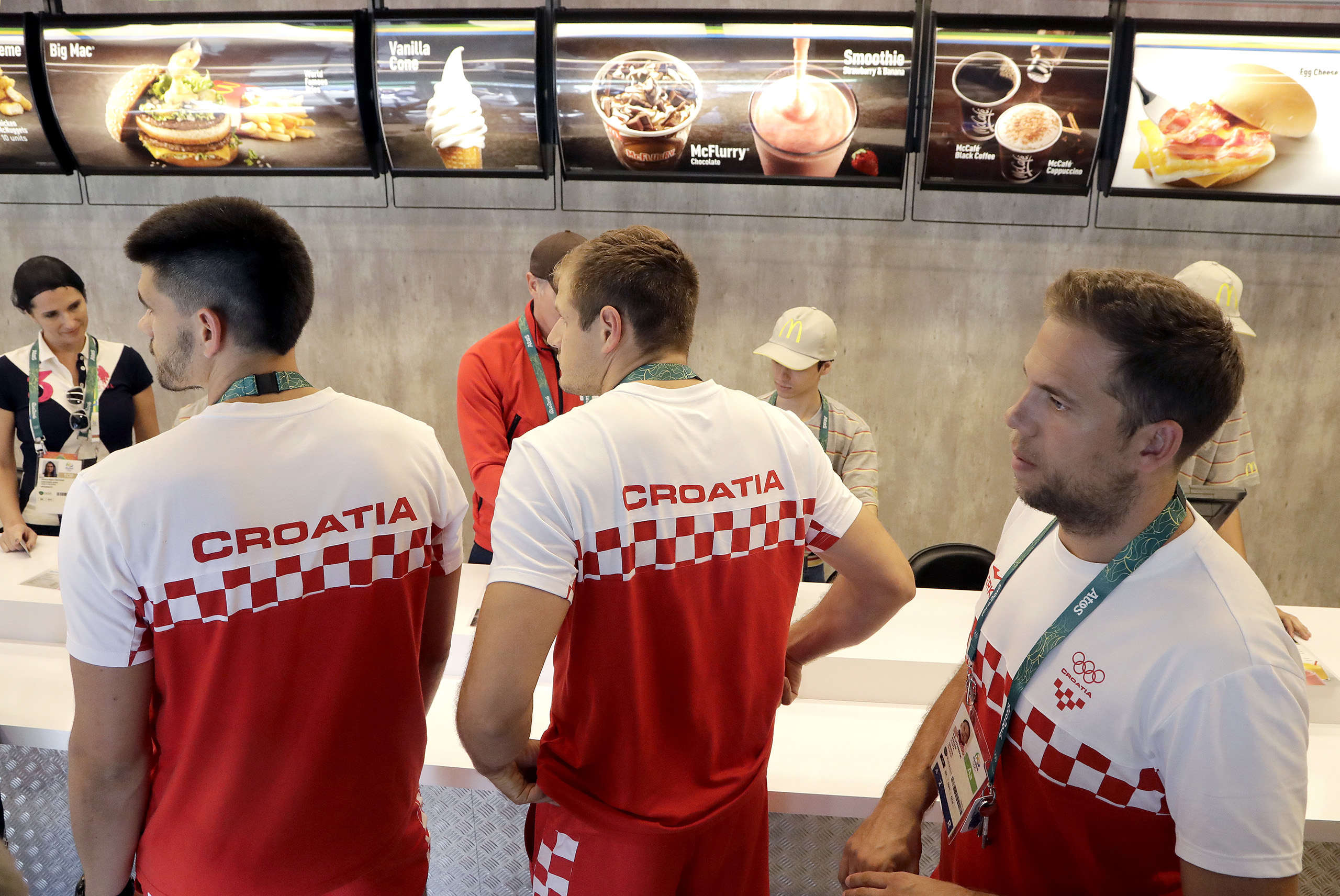 Members of the Croatian handball team wait for their meal at a McDonalds in the Olympic athletes village in Rio de Janeiro, Brazil, July 30, 2016. (Charlie Riedel—AP)
