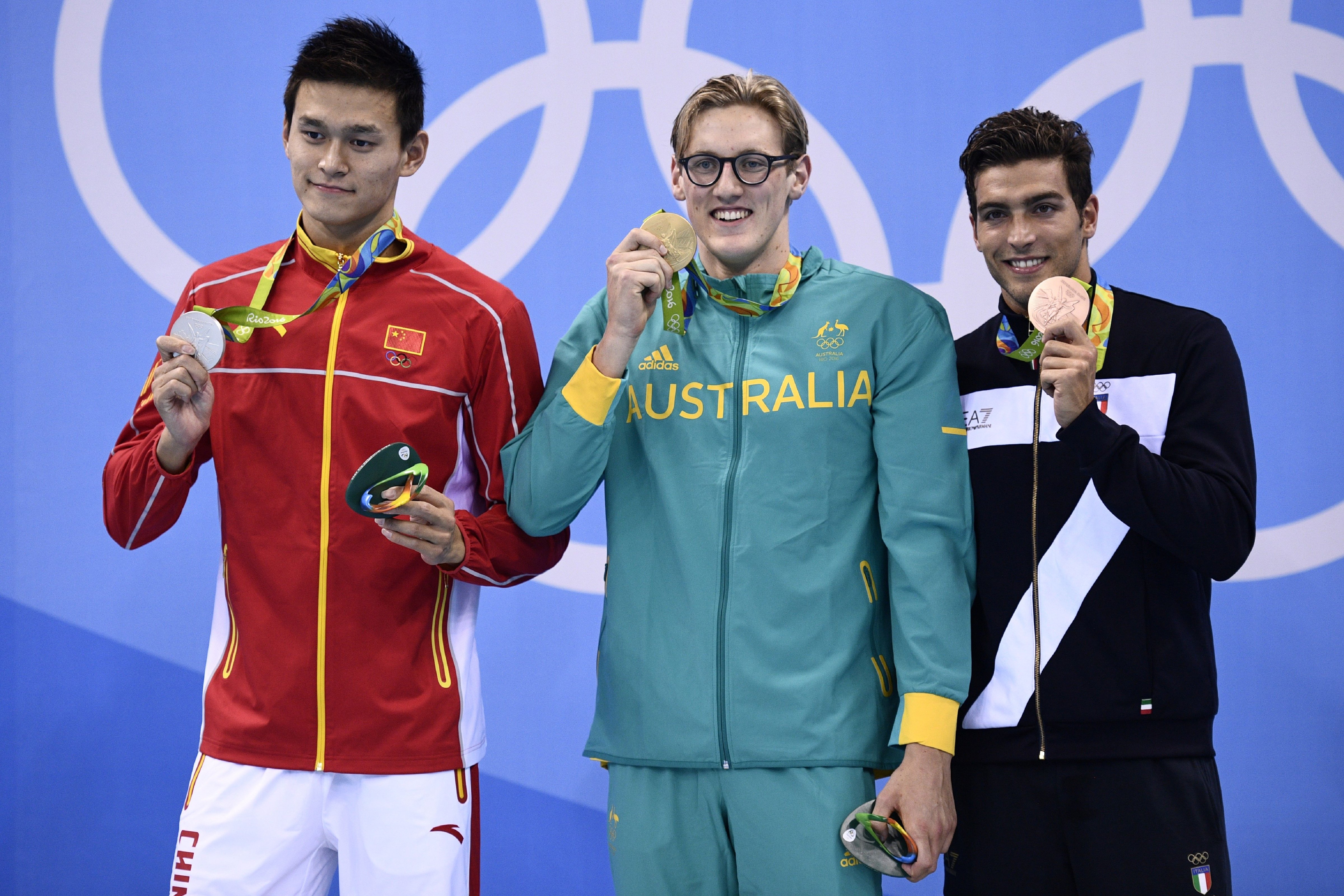 Australia's Mack Horton, center, poses on the podium with silver medallist China's Sun Yang, left, and bronze medallist Italy's Grabriele Detti after he won the Men's 400m Freestyle Final during the swimming event at the Rio 2016 Olympic Games at the Olympic Aquatics Stadium on Aug. 6, 2016. (Martin Bureau—AFP/Getty Images)