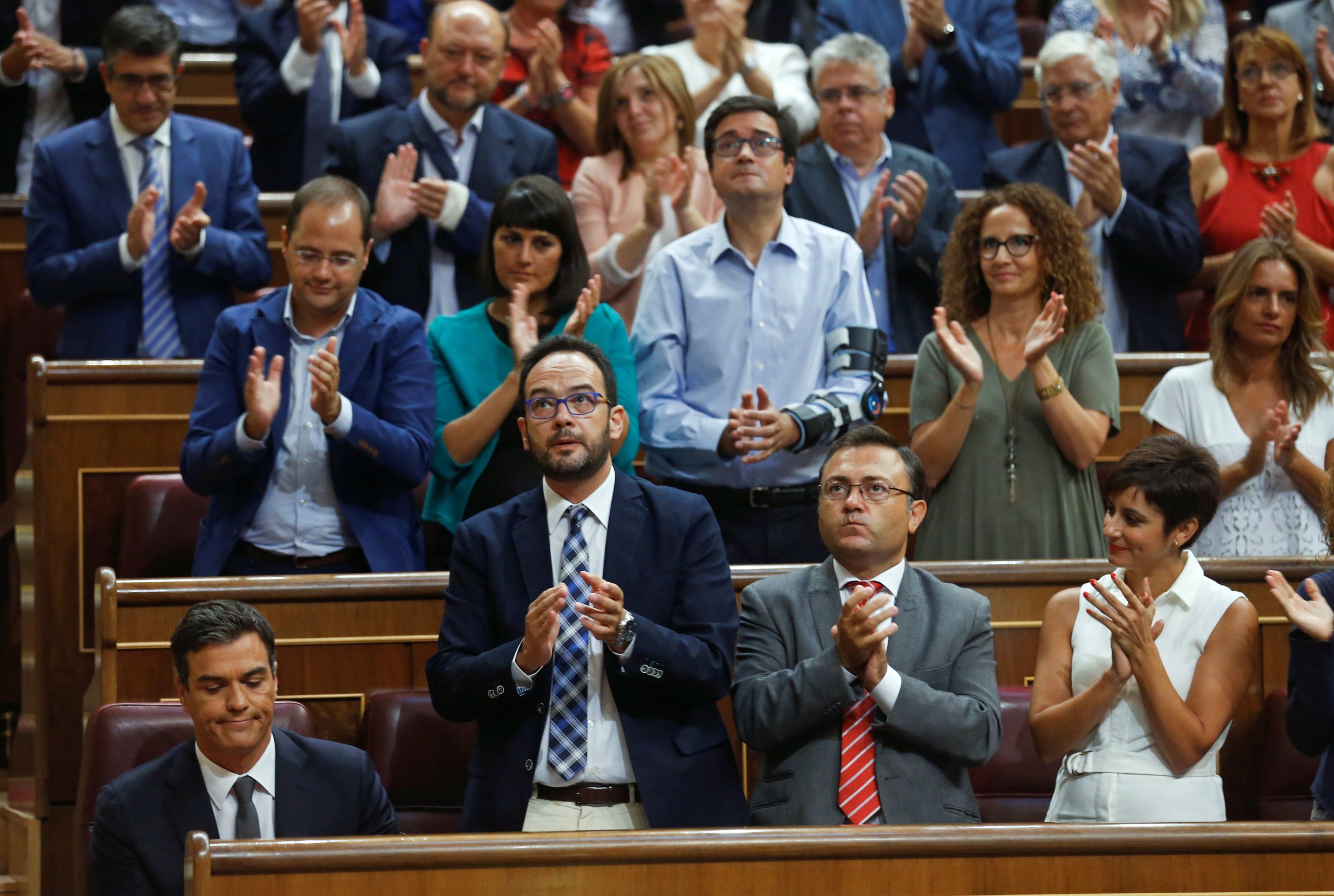 Spain's Socialist party leader Sanchez is applauded by party members after delivering a speech at parliament in Madrid