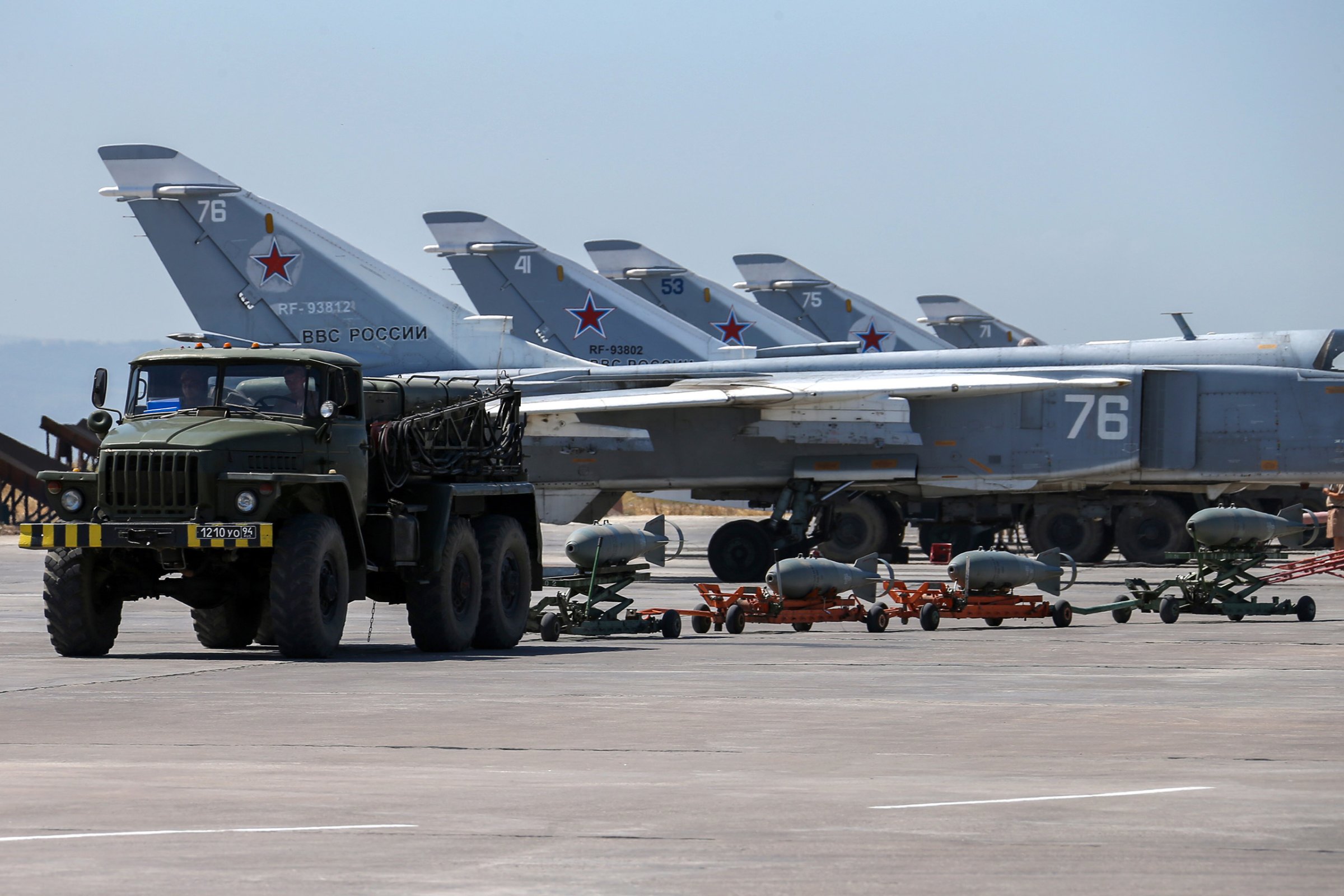 Russian fighter jets and bombers are parked at Hemeimeem air base in Syria on June 18, 2016.