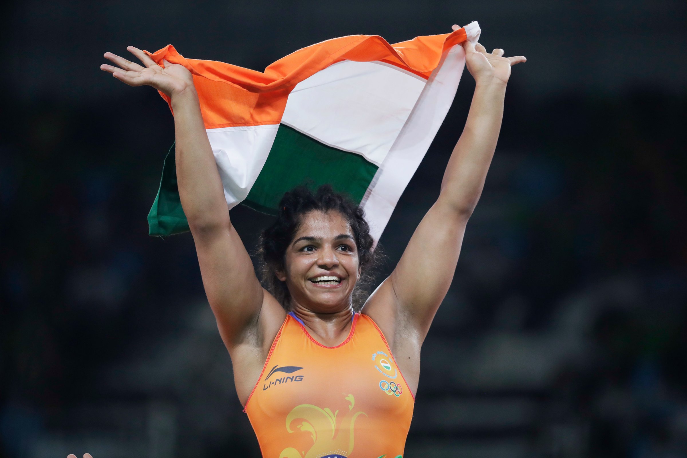 India's Sakshi Malik reacts after winning bronze against Kyrgyzstan's Aisuluu Tynybekova in the women's wrestling freestyle 58-kg competition at the 2016 Summer Olympics in Rio de Janeiro on Aug. 17, 2016.