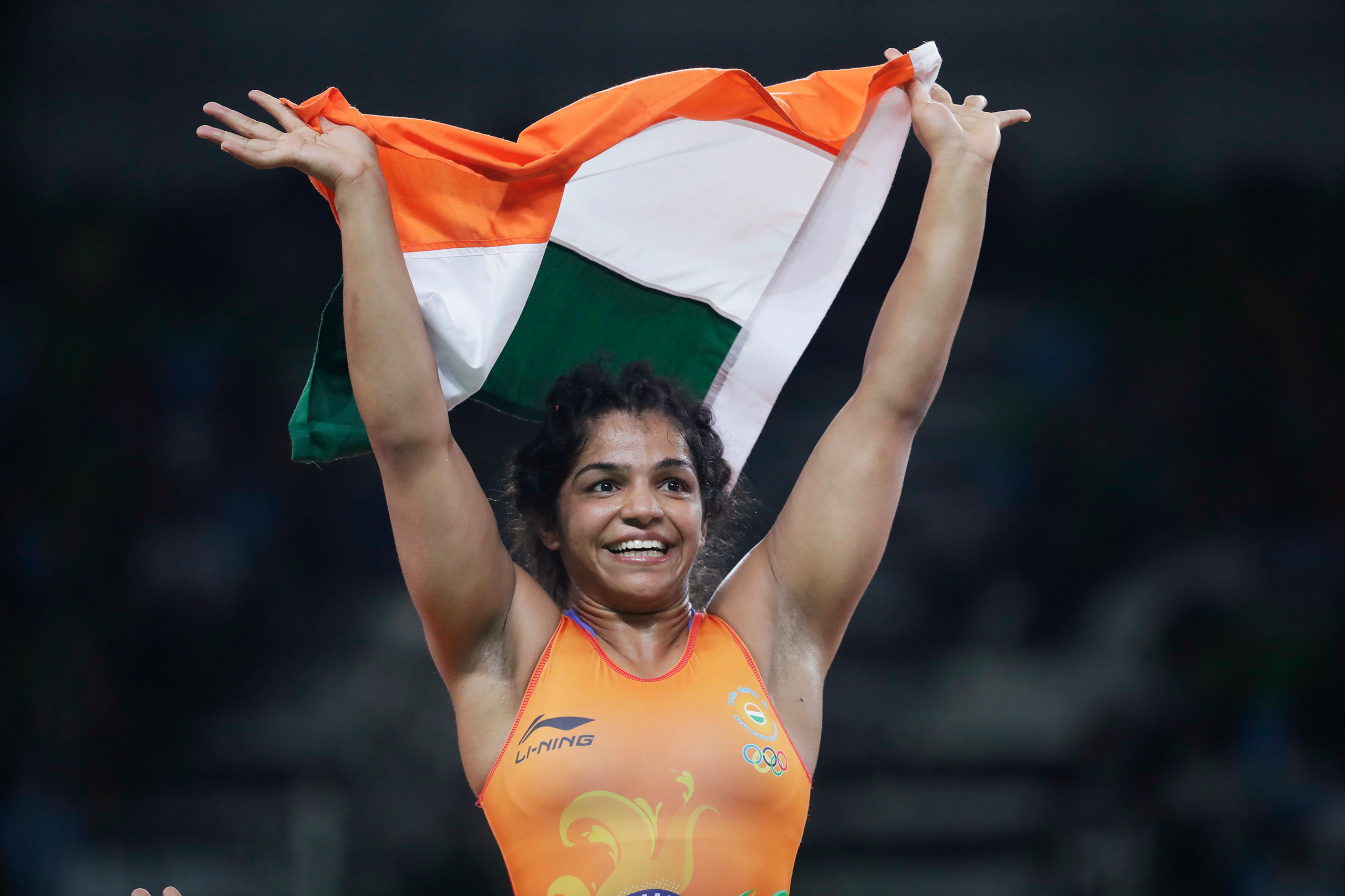 India's Sakshi Malik reacts after winning bronze against Kyrgyzstan's Aisuluu Tynybekova in the women's wrestling freestyle 58-kg competition at the 2016 Summer Olympics in Rio de Janeiro on Aug. 17, 2016. (Markus Schreiber—AP)