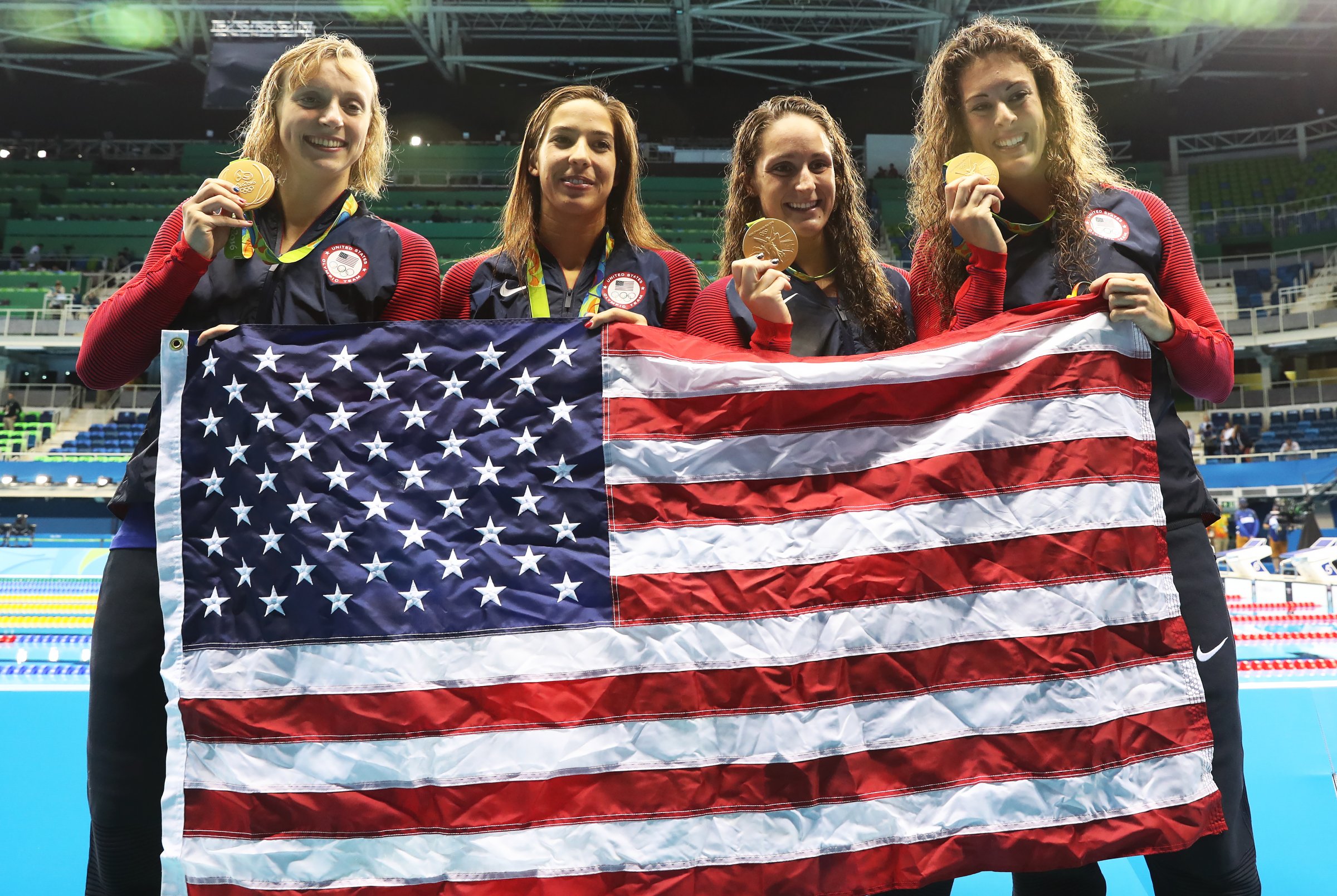 Katie Ledecky, Maya Dirado, Leah Smith and Allison Schimdt of United States pose with their Gold medals from the Women's 4 x 20m Freestyle Relay on Day 5 of the Rio 2016 Olympic Games at the Olympic Aquatics Stadium in Rio de Janeiro on August 10, 2016.