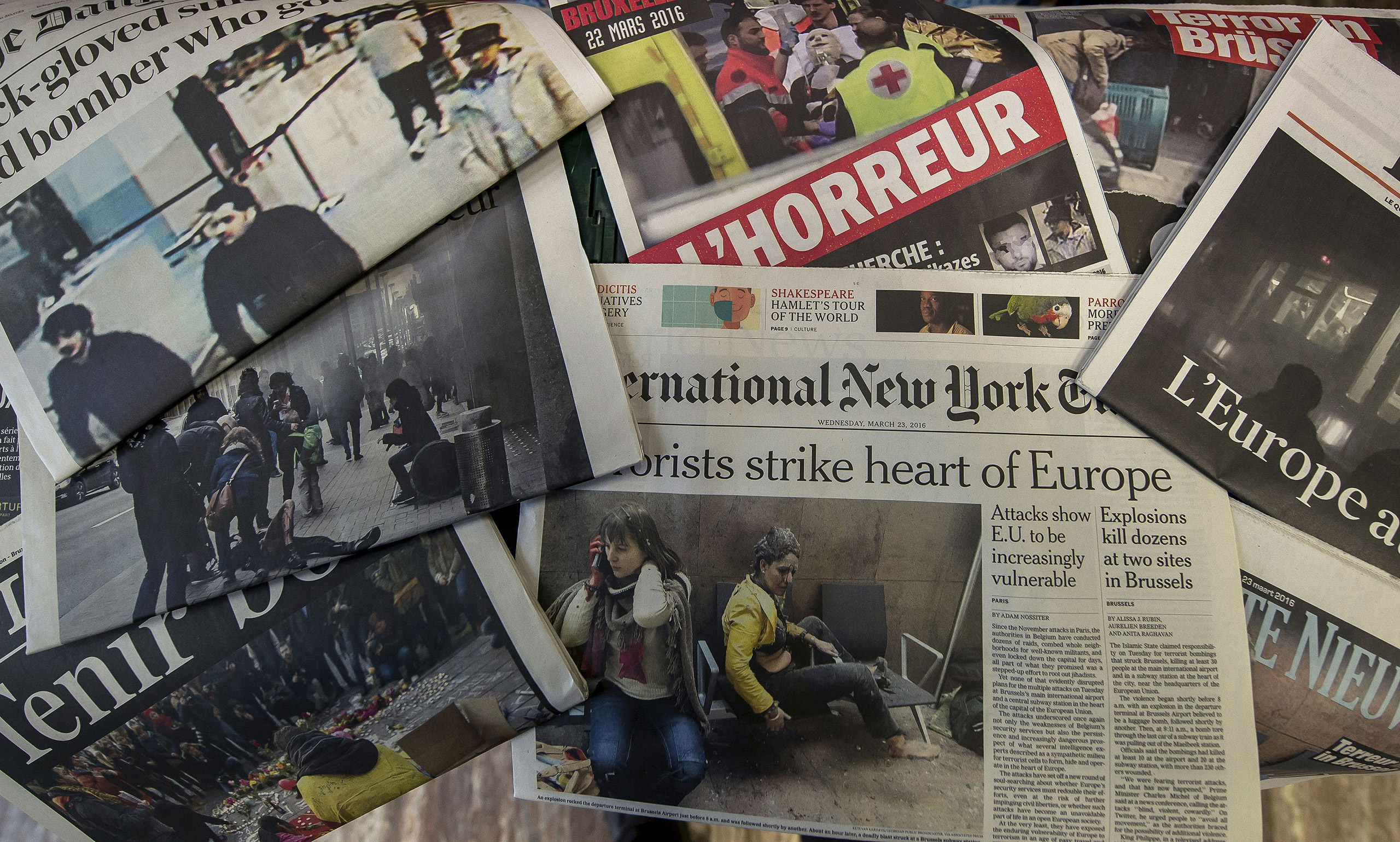 A picture taken on March 23, 2016 in Brussels shows the frontpage of several newspapers, one day after bombings at Zaventem Airport and on a metro train. (Philippe Huguen—AFP/Getty Images)